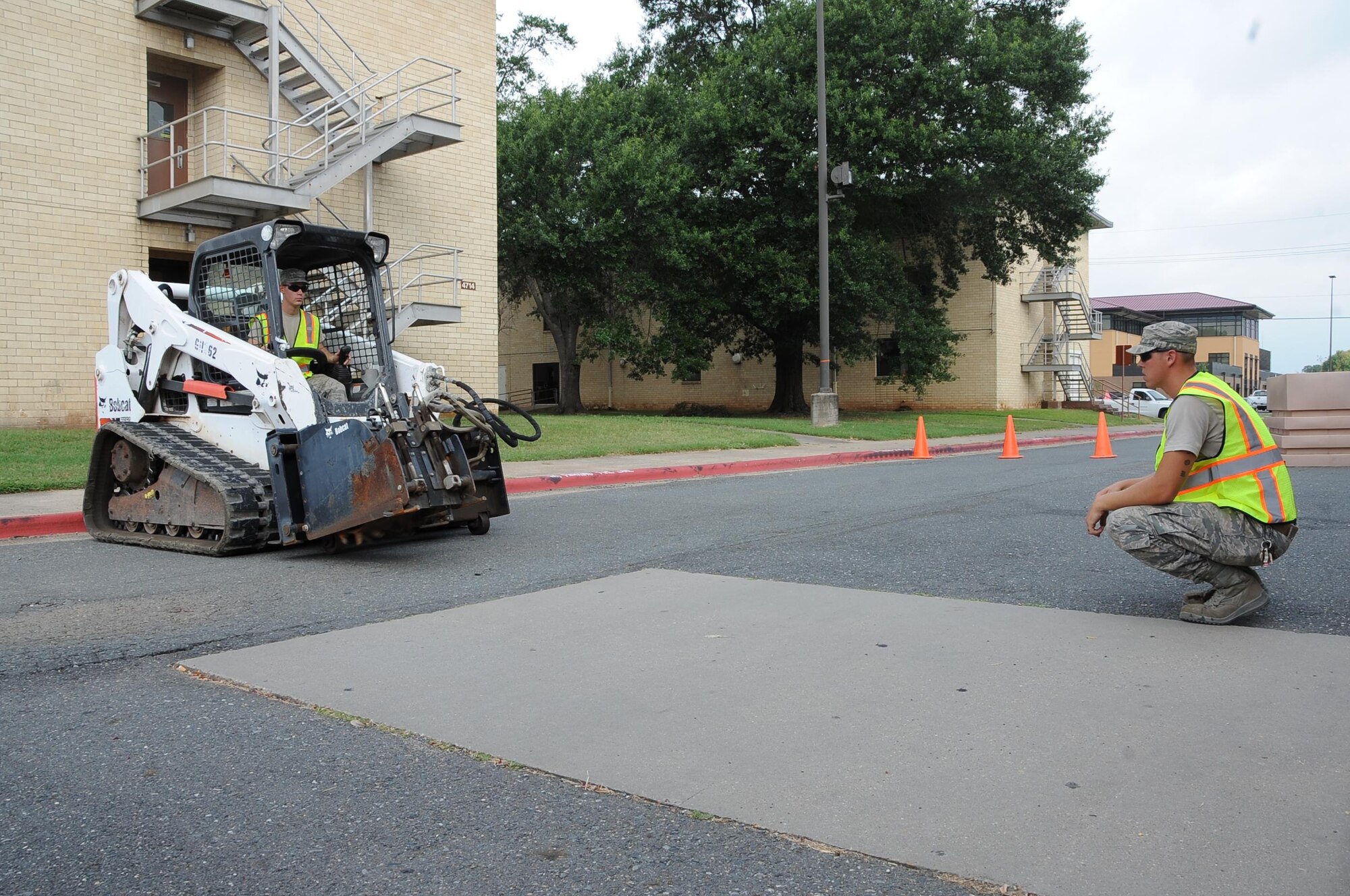 Airmen from the 2nd Civil Engineering Squadron, Pavement and Heavy Equipment Flight, begin road construction at the Exchange at Barksdale Air Force Base, La., July 5, 2016. Pothole repairs can take anywhere from a couple of hours to a couple of weeks to fix. (U.S. Air Force photo/Airman 1st Class Stuart Bright)