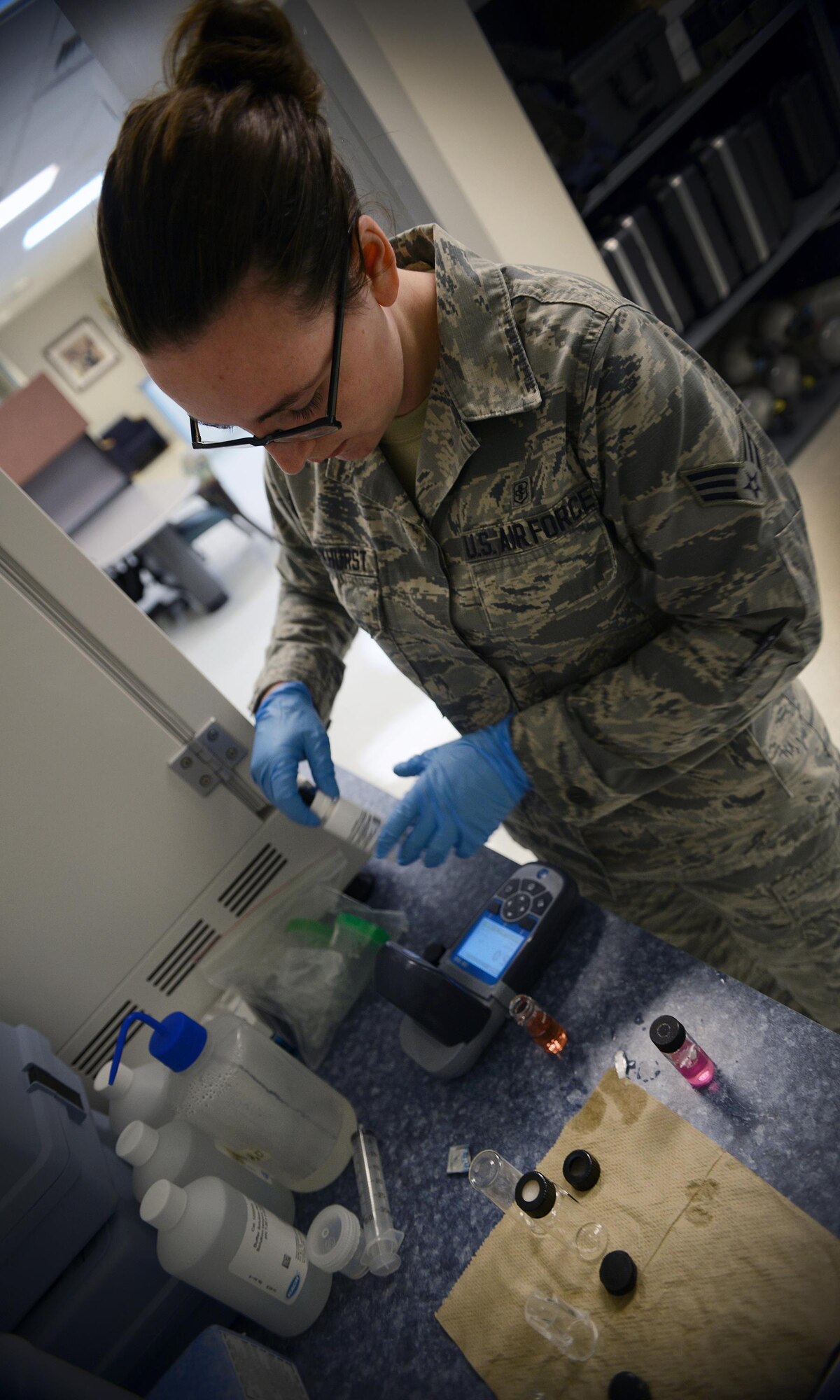 Senior Airman Samantha Parkhurst, 47th Medical Operations Squadron bioenvironmental engineering technician, tests the chemical balance of tap water at the medical clinic on Laughlin Air Force Base, Texas, June 28, 2016. Bioenvironmental engineering specialists focus on reducing health hazards in the workplace and the surrounding areas. (U.S. Air Force photo/Senior Airman Ariel D. Partlow)