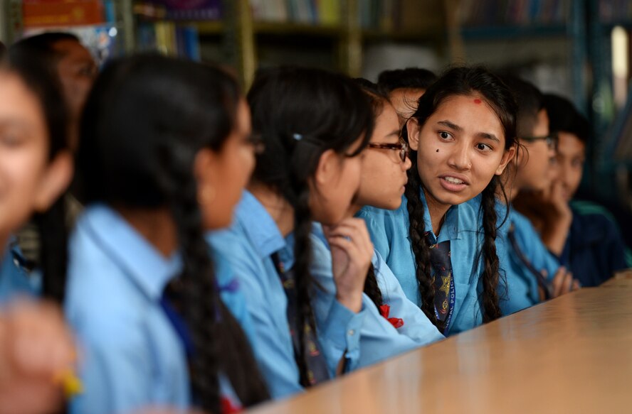 Nepali students decide on a question to ask Airmen during a community outreach event July 4, 2016, in Kathmandu, Nepal. The community outreach event consisted of a question and answer session with Airmen from the 36th Contingency Response Group and the opportunity to play sports. (U.S. Air Force photo by Staff Sgt. Benjamin Gonsier/Released)