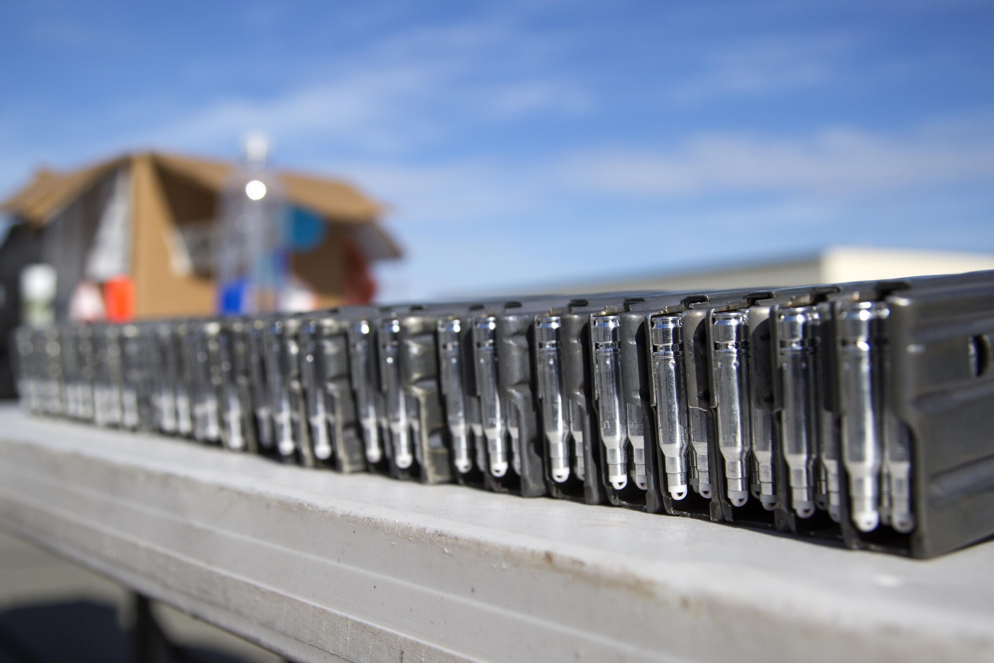 M4 carbine magazines loaded with simulated training rounds are arranged at an ammunition distribution point for security forces personnel, assigned to the 673d Security Forces Squadron, conducting high risk response training at Joint Base Elmendorf-Richardson, Alaska, June 29, 2016. High risk response training provides security forces personnel an intensive, hands-on course based in various real-life scenarios emphasizing effective tactics to engage and eliminate active shooters or other threats. (U.S. Air Force photo/Alejandro Pena)