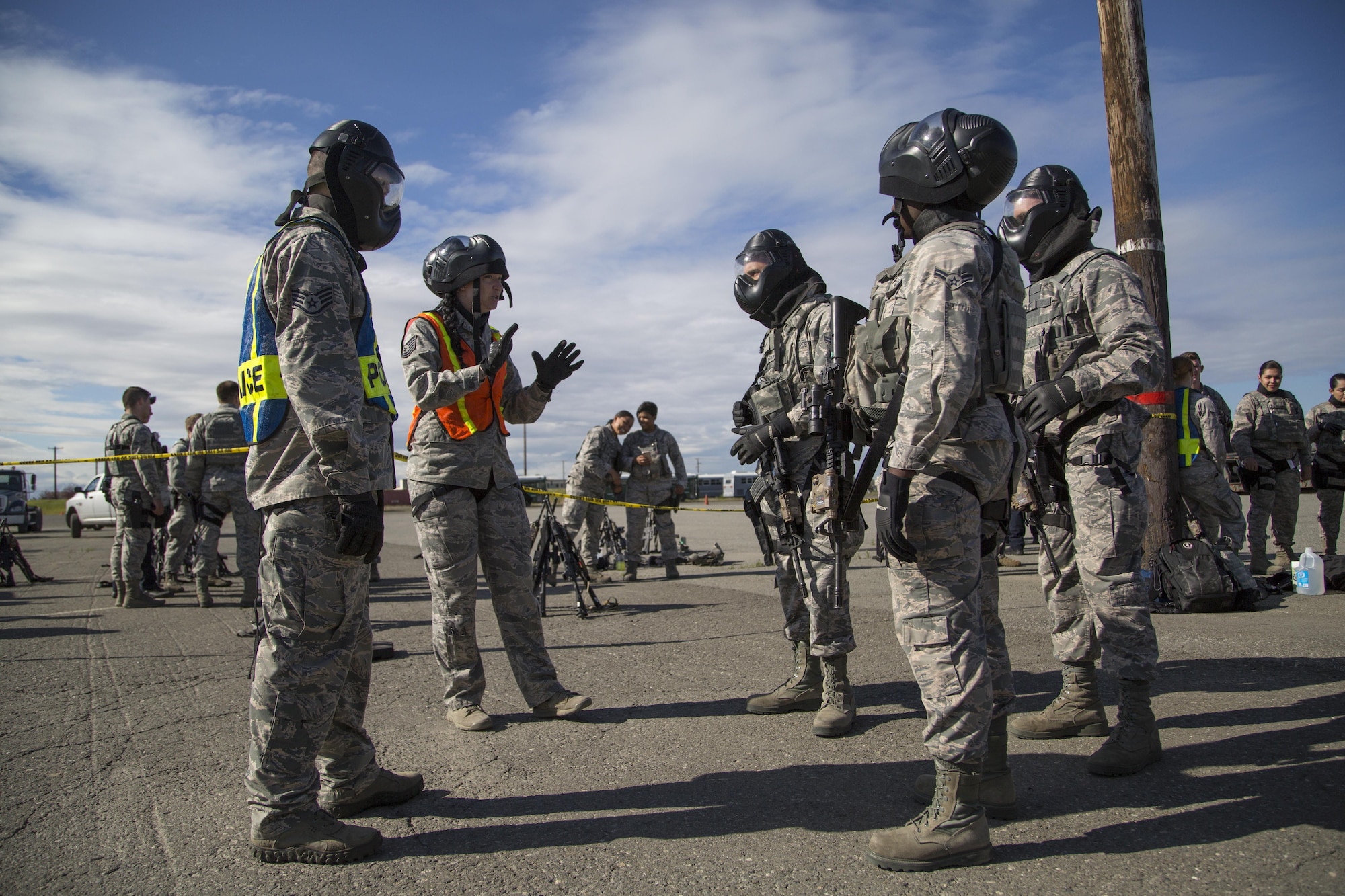 U.S. Air Force security forces personnel, assigned to the 673d Security Forces Squadron, receive a safety brief before conducting high risk response training at Joint Base Elmendorf-Richardson, Alaska, June 29, 2016. High risk response training provides security forces personnel an intensive, hands-on course based in various real-life scenarios emphasizing effective tactics to engage and eliminate active shooters or other threats. (U.S. Air Force photo/Alejandro Pena)