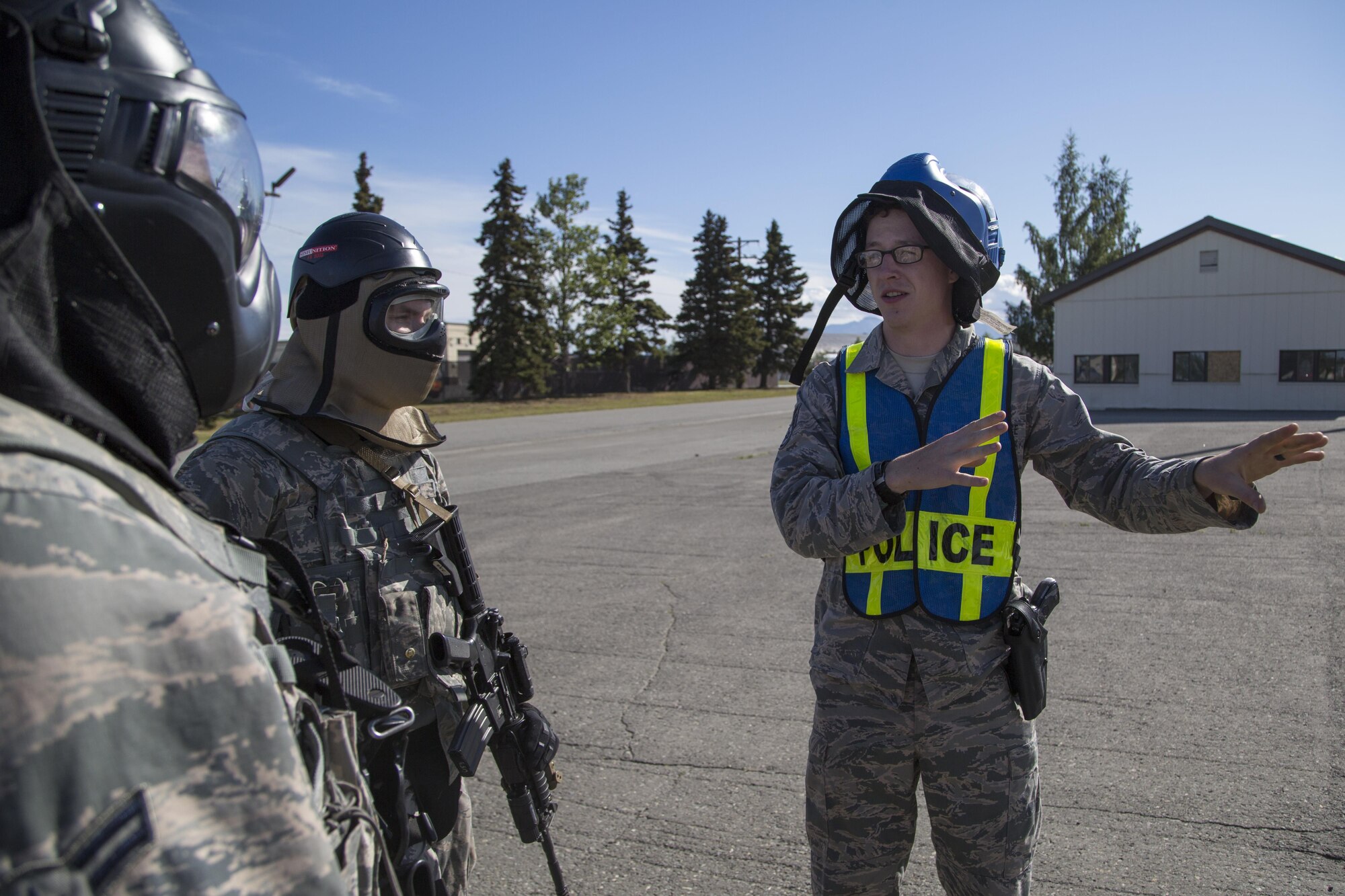 U.S. Air Force Staff Sgt. Adrian Durr, right, delivers a safety brief to fellow security forces personnel, assigned to the 673d Security Forces Squadron, before conducting high risk response training at Joint Base Elmendorf-Richardson, Alaska, June 29, 2016. High risk response training provides security forces personnel an intensive course based in various real-life scenarios emphasizing effective tactics to engage and eliminate active shooters or other threats. (U.S. Air Force photo/Alejandro Pena)