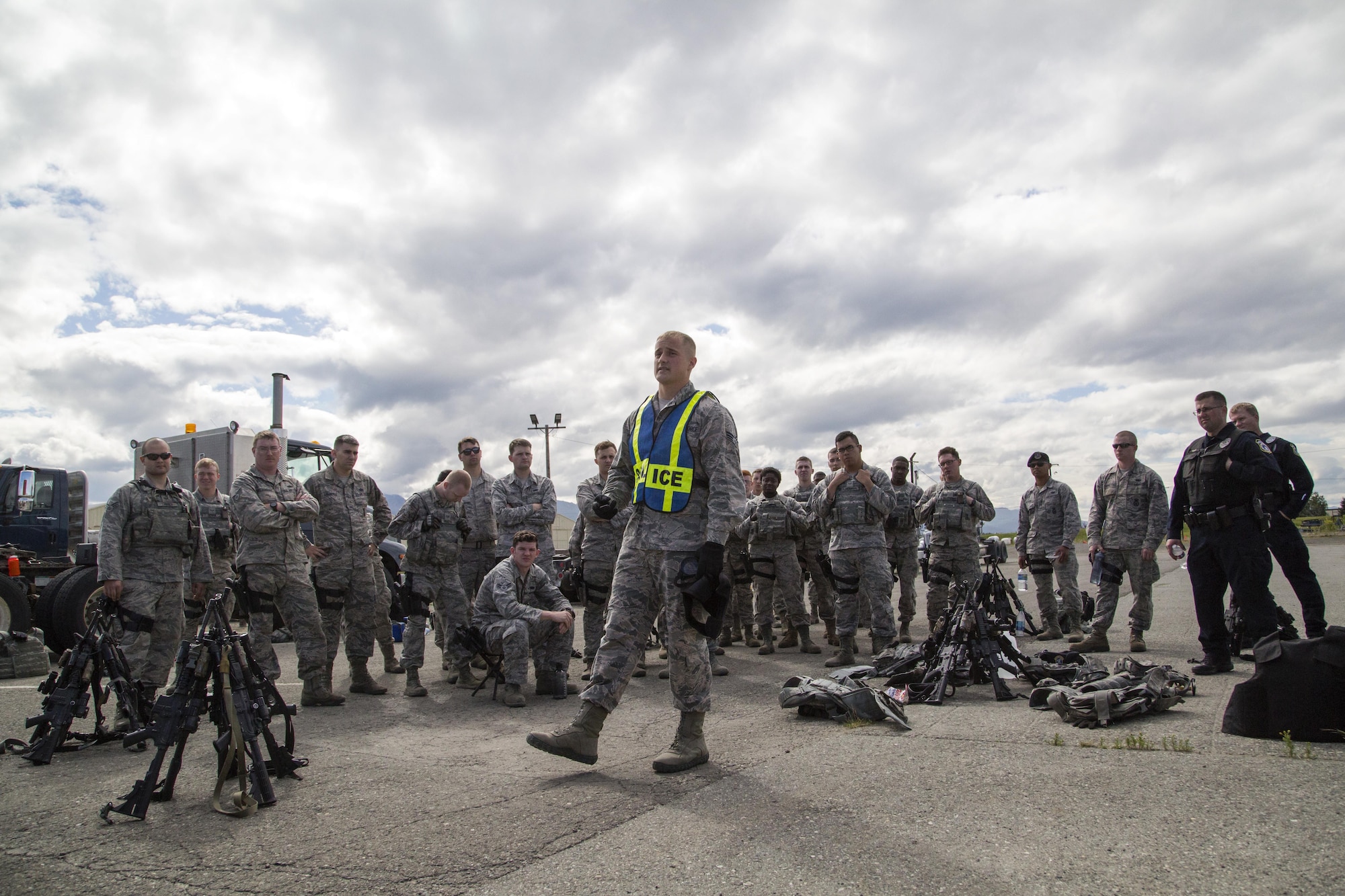 Security forces personnel, assigned to the 673d Security Forces Squadron, debrief after conducting high risk response training at Joint Base Elmendorf-Richardson, Alaska, June 29, 2016. High risk response training provides security forces personnel an intensive, hands-on course based in various real-life scenarios emphasizing effective tactics to engage and eliminate active shooters or other threats. (U.S. Air Force photo/Alejandro Pena)
