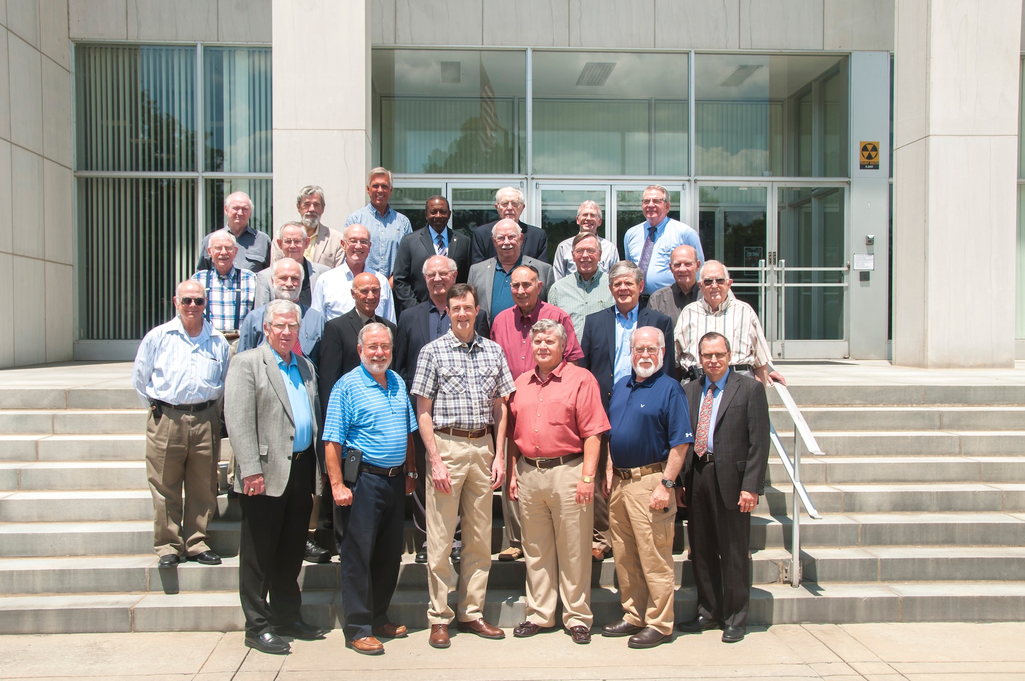 Twenty-three AEDC Fellows met at the Complex June 23 for Fellows’ Day. Pictured left to right, first row: AEDC Chief Technologist and AEDC Fellow Dr. Edward Kraft; 2016 Fellows Tom Best and Dr. Rob McAmis; 2016 Lifetime Achievement Fellows Bob Lindeman and Claude Morse; and AEDC Executive Director Dr. Mark Mehalic. Second row: Fellows Frederick Shope, Mike Mills, Ron Polce, retired Maj. Gen. Michael Wiedemer (a former AEDC commander), Dr. John Davis, Dr. Grant Patterson, and Marion Laster. Third row: Fellows Dennis Horn, Dr. Bill Baker, Keith Kushman, Jerry Jones, Dave Bond and John Rampy. Fourth row: Dr. William Kimzey, Dr. Glenn Lazalier and John Sutton; Dr. Woodrow Whitlow with National Aerospace Solutions; Fellows Milton Davis Sr. and David Beale; and retired Col. Larry Gravis, a former AEDC commander. AEDC Fellows are past and present personnel recognized for their accomplishments and contributions to the Complex. (U.S. Air Force photo/Holly Peterson)