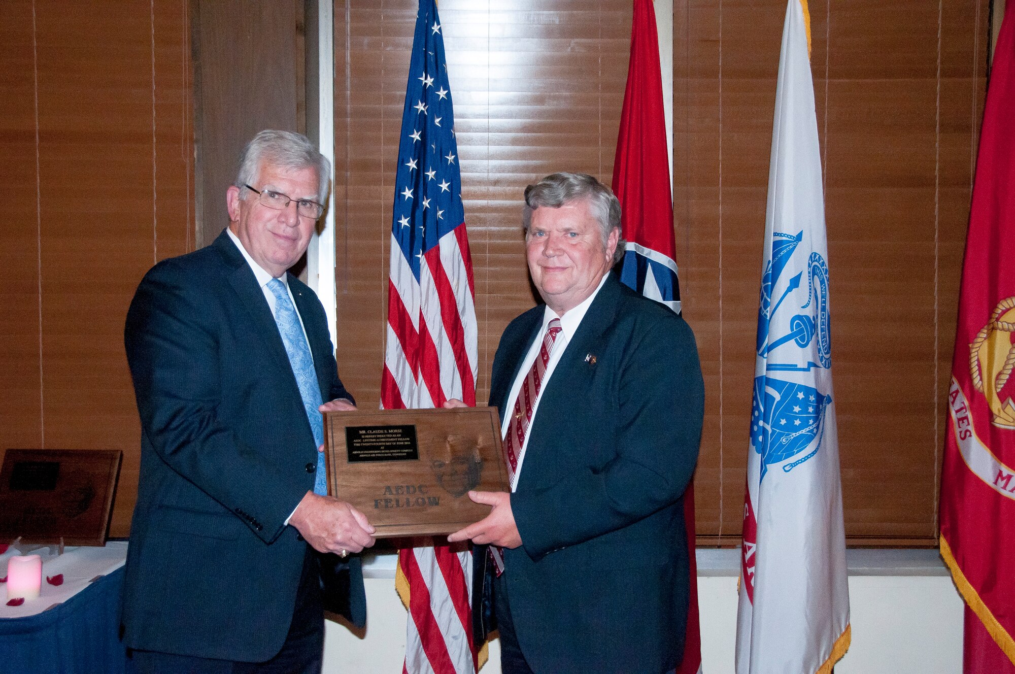 Bob Lindeman (right), receives the AEDC Lifetime Achievement Fellows plaque from AEDC Chief Technologist Dr. Edward Kraft during a banquet June 24 at the Arnold Lakeside Center, in recognition of being inducted as a 2016 AEDC Fellow. (U.S. Air Force photo/Holly Peterson)