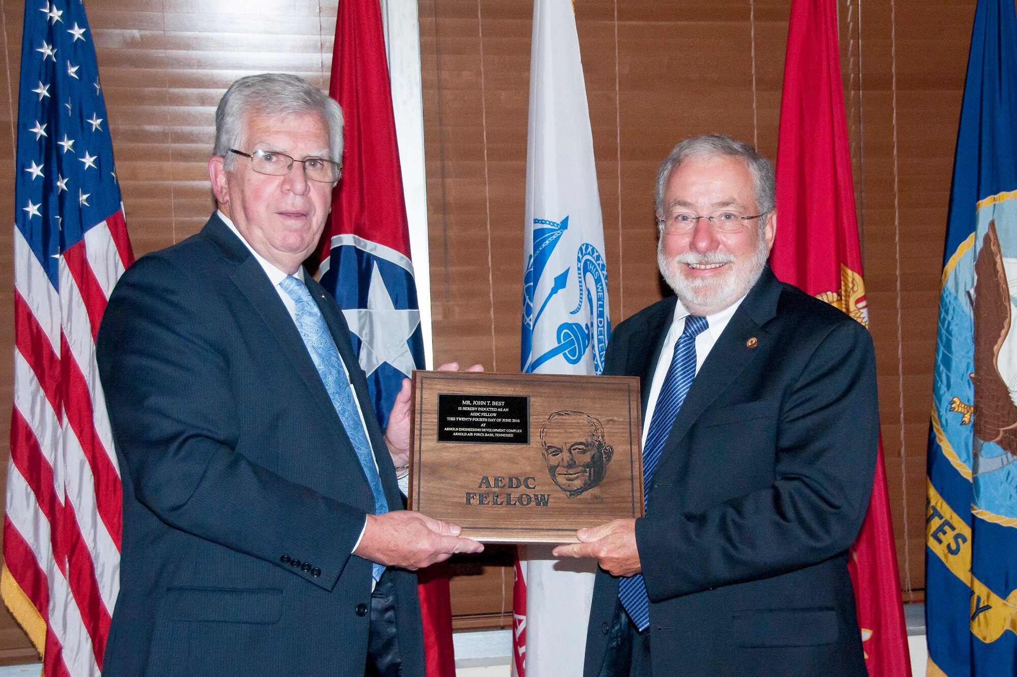 Tom Best (right), receives the AEDC Fellows plaque from AEDC Chief Technologist Dr. Edward Kraft during the Fellows banquet June 24 at the Arnold Lakeside Center, in recognition of being inducted as a 2016 AEDC Fellow. (U.S. Air Force photo/Holly Peterson)