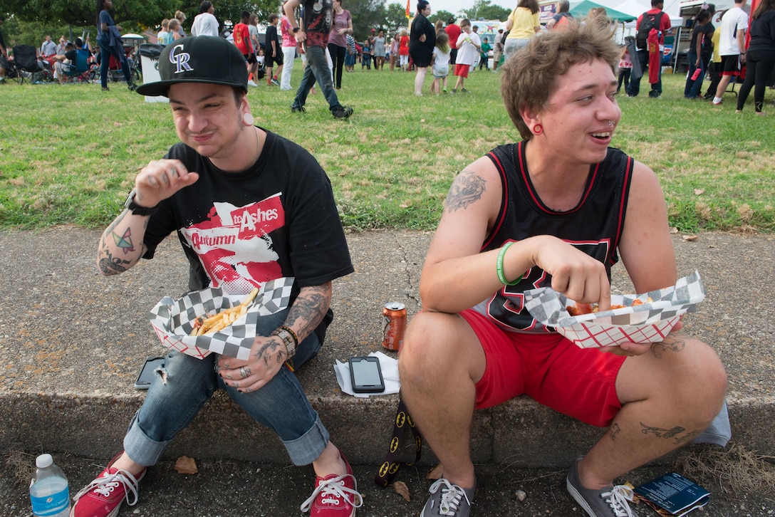 FORT MONROE, Va. -- Lauren Tucker (left) and Aiden Nash scarf down some French fries at the Fourth on the Fort Independence Day celebration, July 4. The festivities began at 10:00 a.m. and included several food vendors, performances by the Air Force Heritage of America Band, tours of the fort and a fireworks display. (U.S. Air Force photo/Master Sgt. Benjamin Wilson)