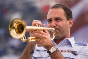 FORT MONROE, Va. -- U.S. Air Force Airman 1st Class Mark Morgan, U.S. Air Force Heritage of America Band trumpet player, belts out a solo during an Independence Day performance at Fort Monroe, Va., July 4. The band is celebrating its 75th anniversary this year. (U.S. Air Force photo/Master Sgt. Benjamin Wilson)