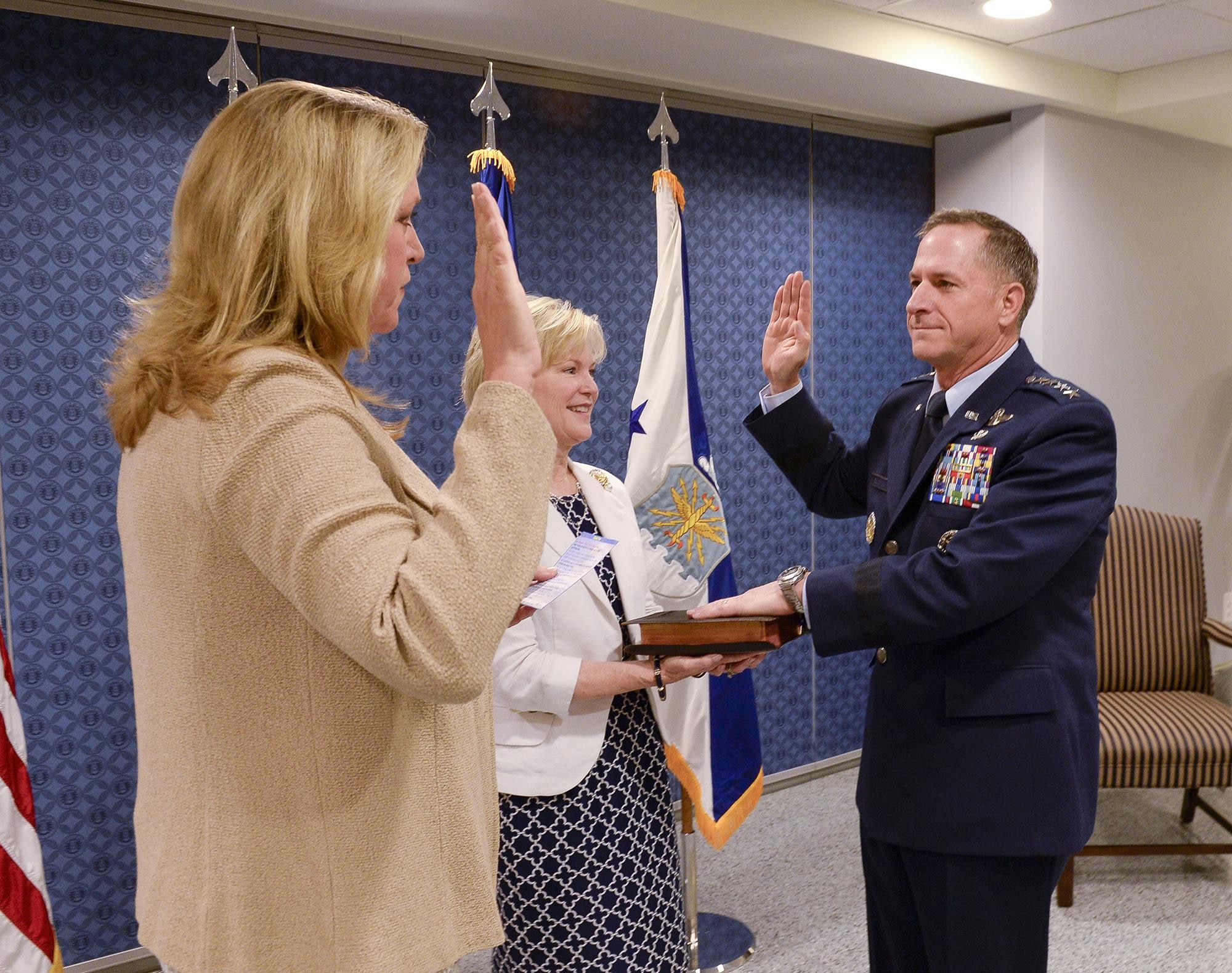 Air Force Secretary Deborah Lee James reads the oath of office to Air Force Chief of Staff Gen. David L. Goldfein as his wife, Dawn, holds the chief of staff Bible during a swearing-in ceremony at the Pentagon in Washington, D.C., July 1. Goldfein became the 21st chief of staff of the Air Force. (U.S. Air Force photo/Andy Morataya)