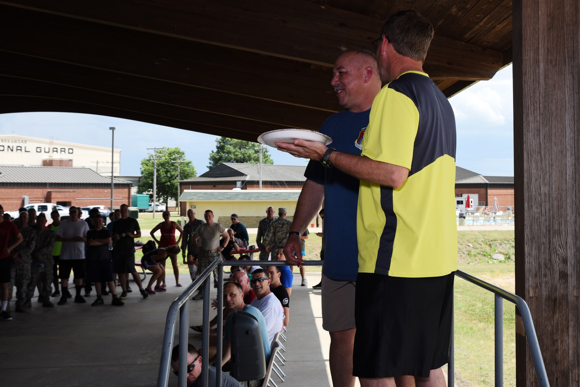 Lt. Col. John Easley, 188th Intelligence Support Squadron commander, left, and Chief Master Sgt. Carl Schneider, 188th ISS superintendent, participate in a fundraiser June 26, 2016, after drill to raise money for the base pool at Ebbing Air National Guard Base, Fort Smith, Ark. Airmen purchased raffle tickets for a chance to pie their commanders, raising over $3,000 to help support the pool for Airmen and their families. (U.S. Air National Guard photo by Senior Airman Matthew Matlock/Released)