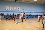 Opening jump-ball of Game 10 during the 2016 Armed Forces Women's Basketball Championship at JB San Antonio-Lackland AFB, Texas.  Army wins the contest 99-34 over the Marine Corps.