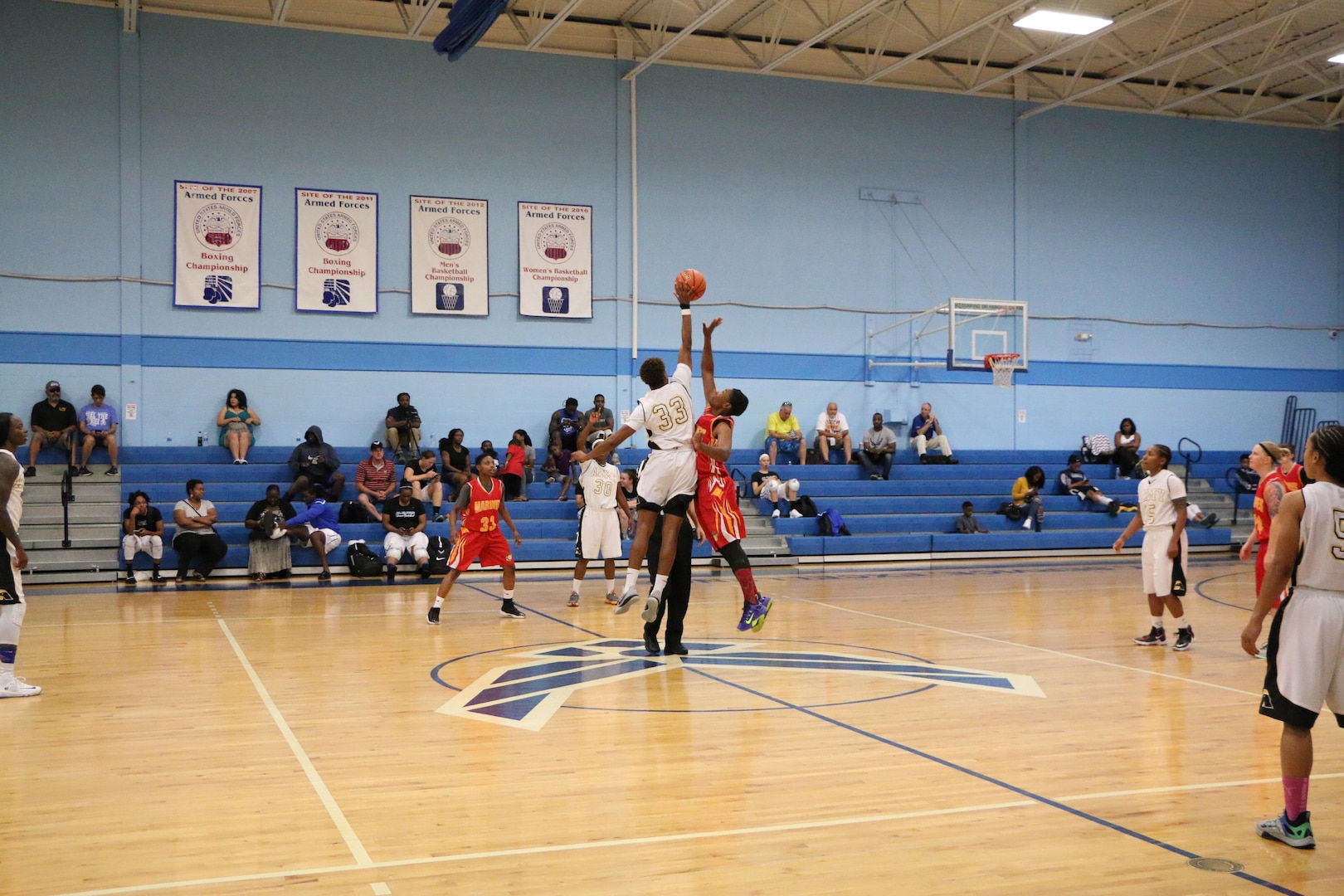 Opening jump-ball of Game 10 during the 2016 Armed Forces Women's Basketball Championship at JB San Antonio-Lackland AFB, Texas.  Army wins the contest 99-34 over the Marine Corps.