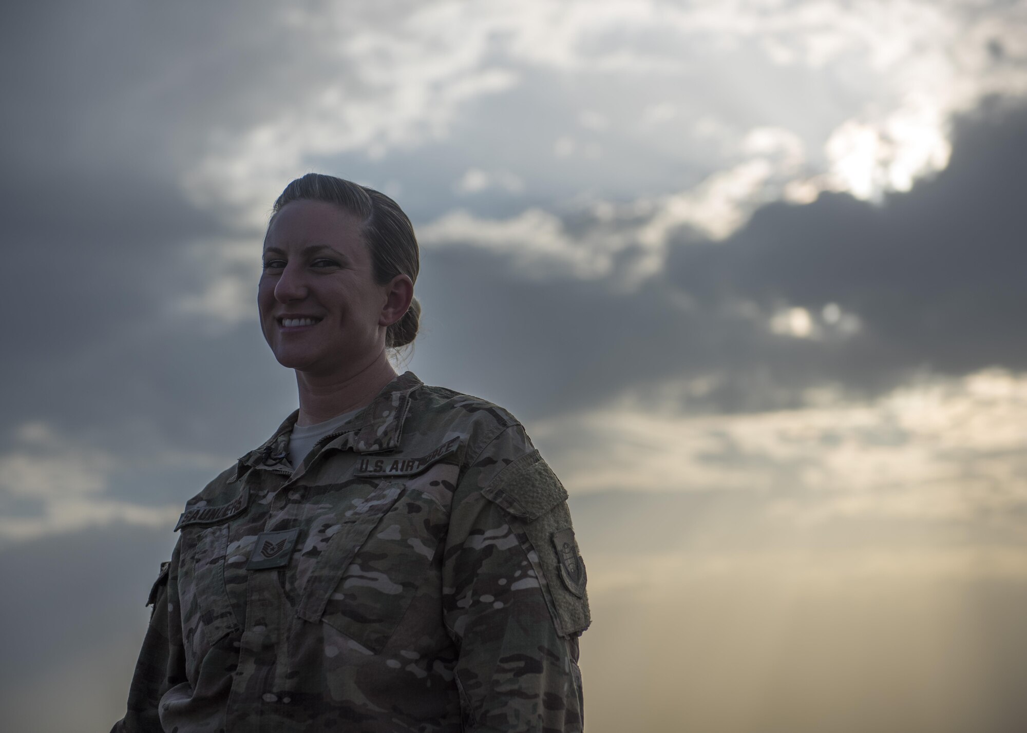 Tech. Sgt. Amy Saunders, 455th Expeditionary Operation Support Squadron, Detachment 1 airfield management liaison officer, poses for a photo during an interview, July 1, 2016, Jalalabad Airfield, Afghanistan. As the airfield management liaison officer, Saunders inspects the runways, taxiways, and ramps to identify violations and ensures airfield operations are being executed within compliance to the regulations. (U.S. Air Force photo illustration by Senior Airman Justyn M. Freeman)