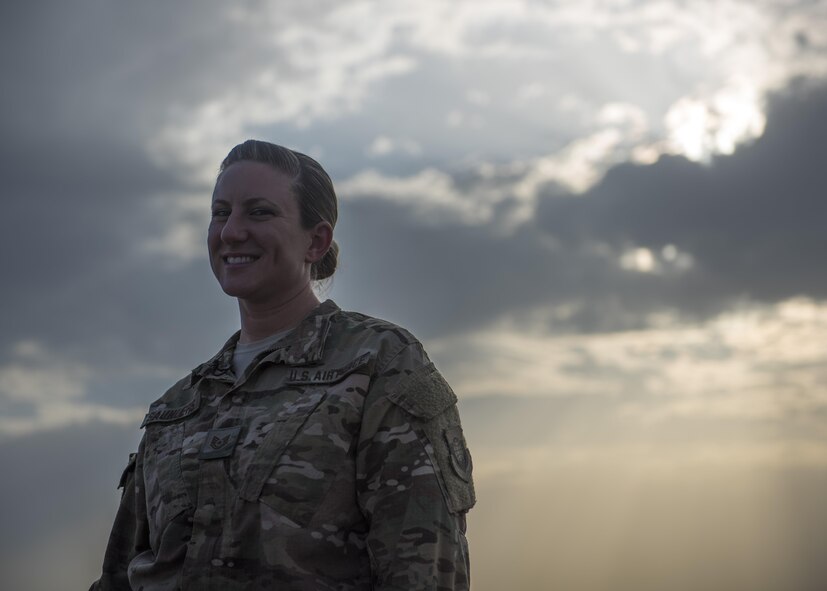 Tech. Sgt. Amy Saunders, 455th Expeditionary Operation Support Squadron, Detachment 1 airfield management liaison officer, poses for a photo during an interview, July 1, 2016, Jalalabad Airfield, Afghanistan. As the airfield management liaison officer, Saunders inspects the runways, taxiways, and ramps to identify violations and ensures airfield operations are being executed within compliance to the regulations. (U.S. Air Force photo illustration by Senior Airman Justyn M. Freeman)