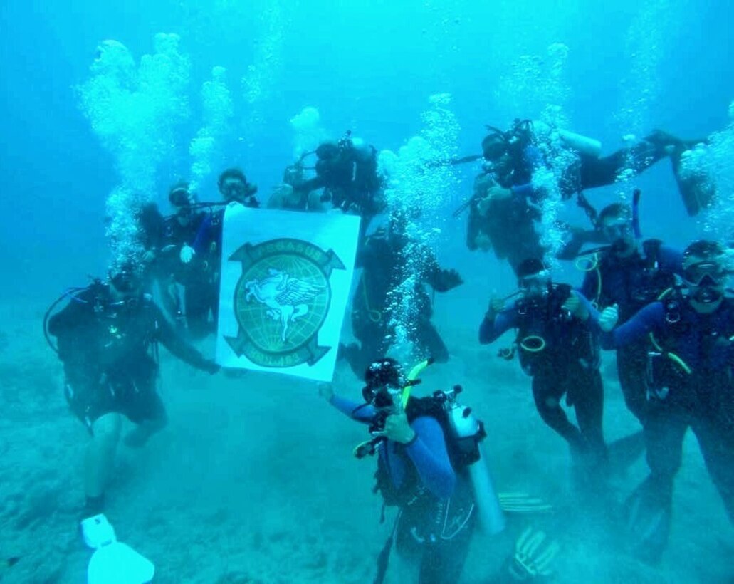 Marines with Marine Aircraft Group 24, a Marine Corps aviation unit based at Marine Corps Air Station Kaneohe Bay, Hawaii, hold a banner under water May 30, 2016,  honoring 12 of their fellow Marines who passed away during a training accident in January 2016. The Marines are part of MAG 24 Dive Group and they spend their free time diving off Hawaii’s coast. The group began as a way to have weekend events that were alcohol-free and provided family-friendly fun.