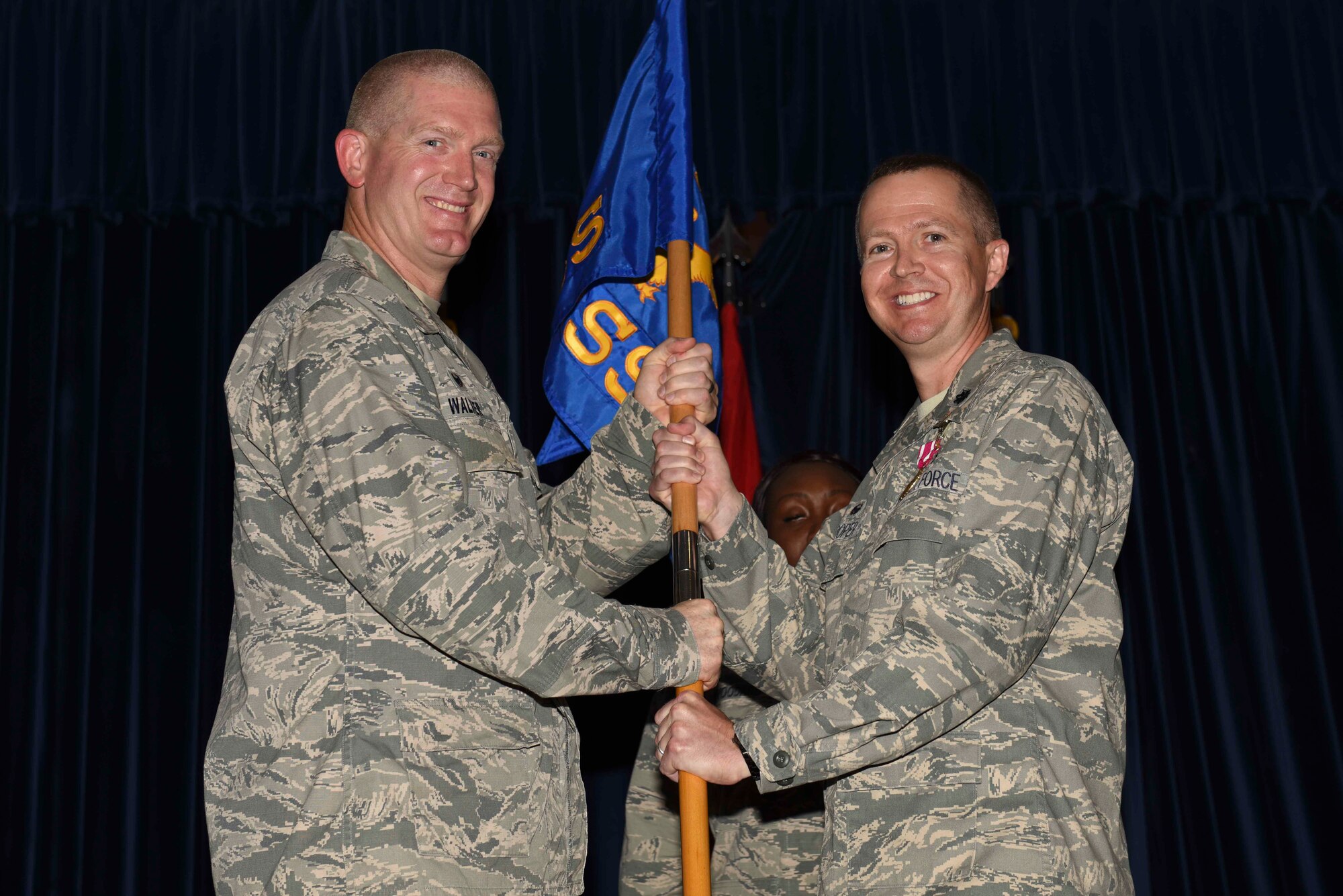U.S. Air Force Lt. Col Jeremy Hooper, 39th Medical Support Squadron outgoing commander, relinquishes command to U.S. Air Force Col. John Walker, 39th Air Base Wing commander, July 7, 2016, at Incirlik Air Base, Turkey. While the 39th MDSS commander, Hooper was responsible for and directed the budget to sustain group personnel and providing healthcare to personnel across Turkey. (U.S. Air Force photo by Airman 1st Class Devin M. Rumbaugh/Released)