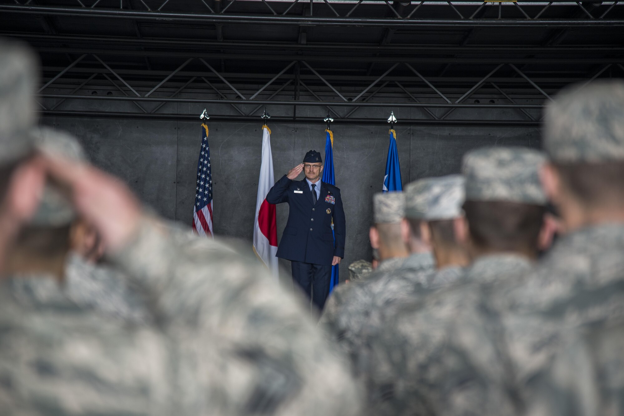 Airmen from the 35th Fighter Wing render their first salute to U.S. Air Force Col. R. Scott Jobe, 35th FW commander, during a change of command ceremony at Misawa Air Base, Japan, July 7, 2016. Prior to arriving at Misawa AB, Jobe was the J53 contingency planning division chief with U.S. Southern Command. (U.S. Air Force photo by Senior Airman Brittany A. Chase)