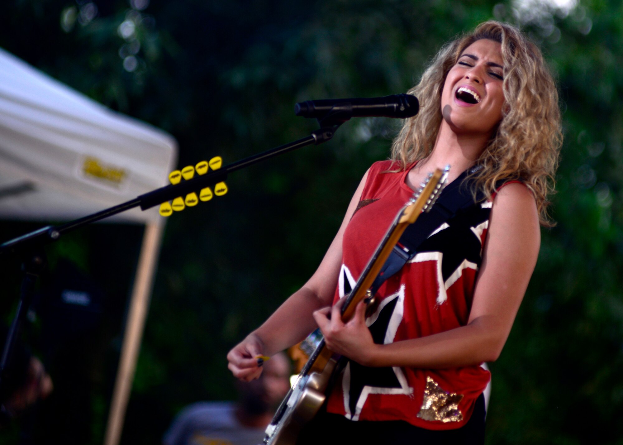 Tori Kelly performs during an Independence Day celebration, July 2, 2016, at Aviano Air Base, Italy. The celebration included live music, bounce houses, face paintings, food booths and more. (U.S. Air Force photo by Senior Airman Areca T. Bell/Released)
