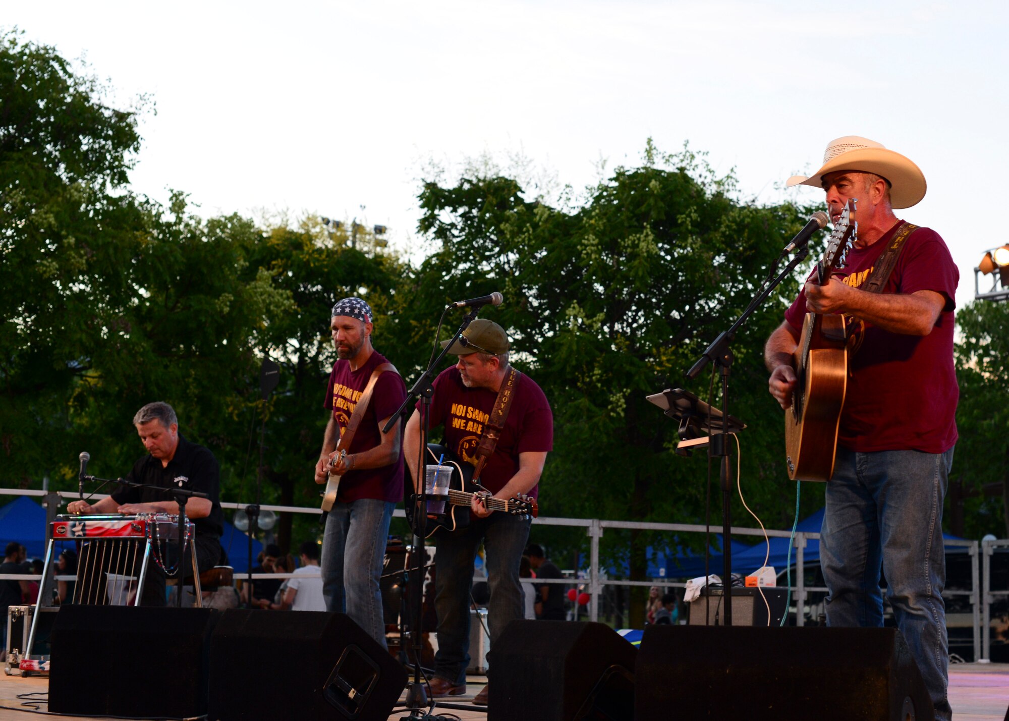 The Dusty Saddle Boys band performs during an Independence Day celebration at Aviano Air Base, Italy, July 4, 2016. The celebration featured live music, activities for children, food booths and a fireworks display. (U.S. Air Force photo by Senior Airman Austin Harvill/Released)