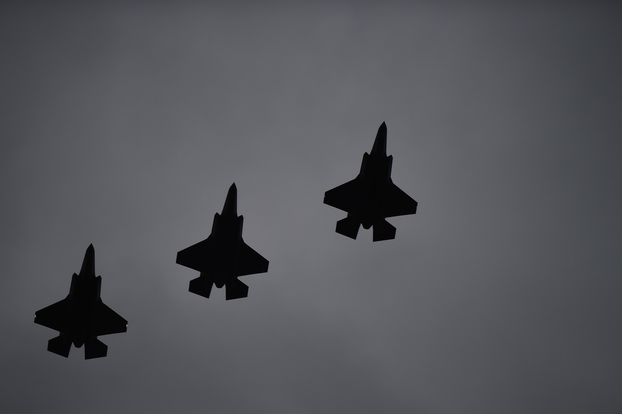 Three F-35A Lightning II's fly over RAF Fairford, United Kingdom, June 30, 2016. The 5th generation fighters made the transatlanic flight with help from the mid-air refueling of a KC-10 tanker. (U.S. Air Force photo by Tech. Sgt. Jarad A. Denton/Released)