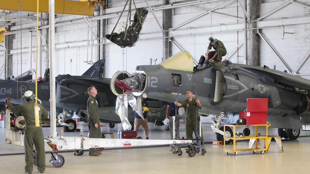 Marines with Marine Attack Squadron 231, Marine Aircraft Group 14, 2nd Marine Aircraft Wing remove an ejection seat from an AV-8B Harrier at Marine Corps Air Station Cherry Point, North Carolina, June 30, 2016. By performing daily tasks and needed maintenance on the aircraft to ensure readiness, Marines maintain their squadron’s ability to deploy at a moment's notice.