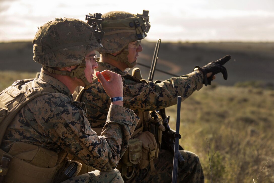 Marine Corps Sgt. Manuel Suarez, right, points out a possible enemy location to Marine Corps Cpl. Adam S. Miles during Exercise Hamel at Cultana Training Area, Australia, July 1, 2016. Suarez, a rifleman, and Miles, a mortarman, are assigned to Alpha Company, 1st Battalion, 1st Marine Regiment, Marine Rotational Force Darwin. Exercise Hamel is a trilateral training exercise with Australian, New Zealand and U.S. forces to enhance cooperation, trust and friendship. Marine Corps photo by Cpl. Carlos Cruz Jr.