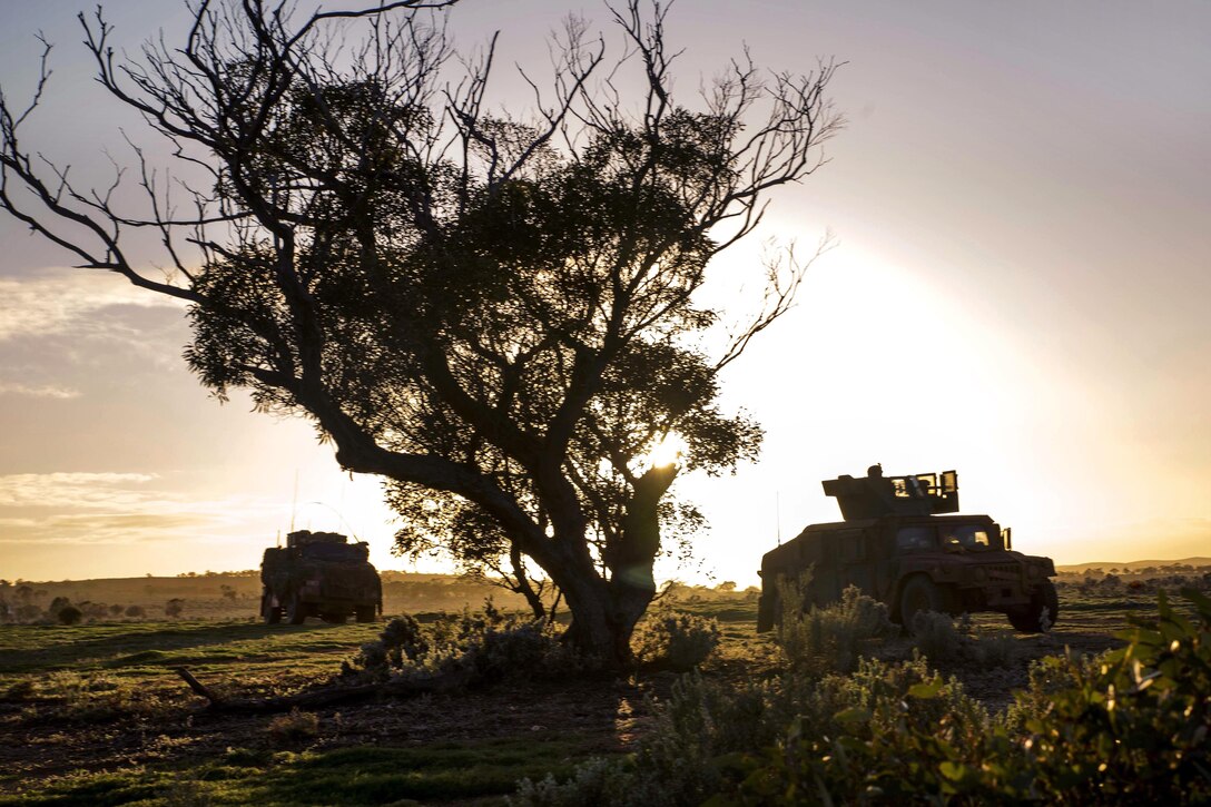 Marines advance in their Humvees to their first objective during Exercise Hamel at Cultana Training Area, Australia, July 1, 2016. Marine Corps photo by Cpl. Carlos Cruz Jr.