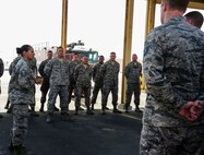 Master Sgt. Amy Hartman, 379th Expeditionary Medical Operations Squadron mental health NCO in charge, briefs firefighters of the 379th Expeditionary Civil Engineer Squadron at Fire Station 3 during their weekly roll call held June 24, 2016, at Al Udeid Air Base, Qatar. The 379th ECES fire department provides word-class fire and emergency service where they protect lives and properties from all hazards. In addition, they also provide premier fire and emergency services and host a robust fire prevention and education program. (U.S. Air Force photo/Senior Airman Janelle Patiño/Released)