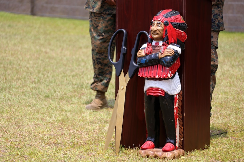 A Chieftain statue and a pair of ceremonial scissors are displayed during a ribbon cutting ceremony at Marine Corps Air Station Cherry Point, N.C., June 24, 2016. Marine  Air Support Squadron 1 received a new, state-of-the-art facility to support several of its units, including the communications, electronics, headquarters and service, and air support company, as well as the unit’s supply section. The complex, which represents a new era of technology for the squadron and the Marine Corps, supports better quality training operations using a new battle lab capable of recreating realistic training missions with outside entities or other communications assets. MASS-1 is an aviation command and control unit responsible for the planning, receiving, coordination and processing of requests for direct or close air support. The Chieftain statue represents the unit’s iconic mascot. (U.S. Marine Corps photo by Cpl. N.W. Huertas/Released) 