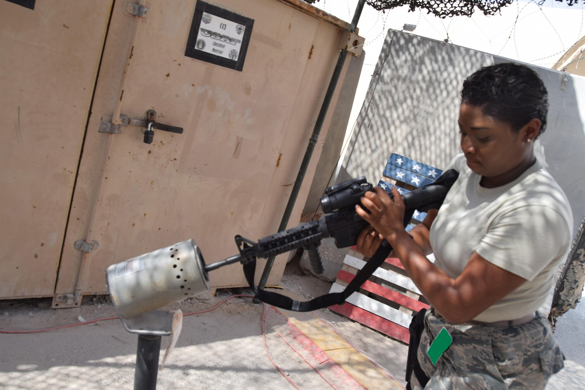 Clearing a weapon is one of the first steps to checking in for transient and permanent party members, and Senior Airman Devondra Randall does just that with an M-4 rifle June 14, 2016 at Al Udeid Air Base, Qatar. Randall, an armory journeyman, is part of the Expeditionary Theater Distribution Center at the 379th Wir Expeditionary Wing. (U.S. Air Force photo/Technical Sgt. Carlos J. Trevino/Released)