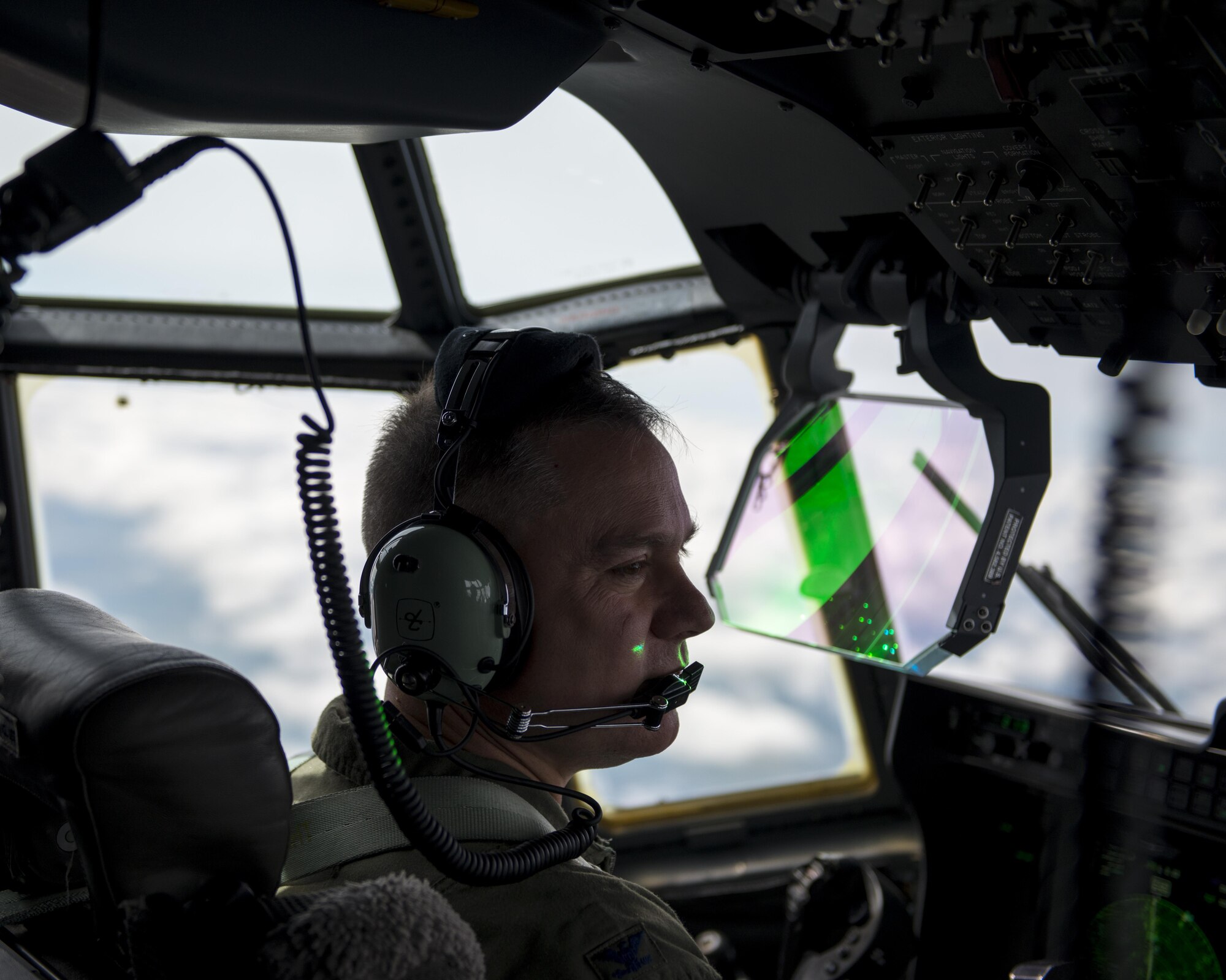 U.S. Air Force Col. William Holt, 352d Special Operations Wing commander, pilots an MC-130J Commando II above Wales, July 6, 2016. This flight served as Holt’s final flight while stationed at RAF Mildenhall.  (U.S. Air Force photo by 1st Lt Chris Sullivan/Released)