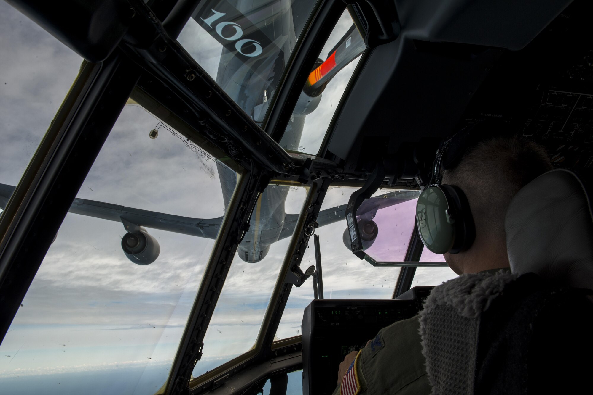 U.S. Air Force Col. William Holt, 352d Special Operations Wing commander, pilots an MC-130J Commando II and receives gas from a KC-135 Stratotanker, flown by U.S. Air Force Col. Thomas Torkelson, 100th Air Refueling Wing commander, July 6, 2016, above the North Sea. This flight served as Holt’s final flight while stationed at RAF Mildenhall and showcased the strong bond between the two collocated units. (U.S. Air Force photo by 1st Lt Chris Sullivan/Released)