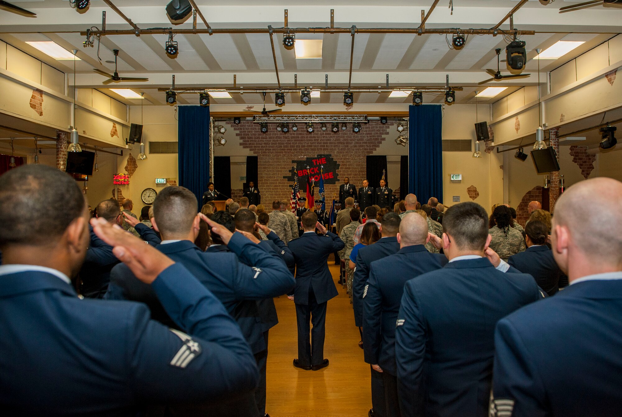 Members of the 52nd Medical Support Squadron salute in formation during the 52nd MDSS change of command ceremony in the Brickhouse on Spangdahlem Air Base, Germany, June 30, 2016. Family and friends of both the outgoing and incoming 52nd MDSS commanders of the attended the ceremony. (U.S. Air Force photo by Airman 1st Class Timothy Kim/Released)