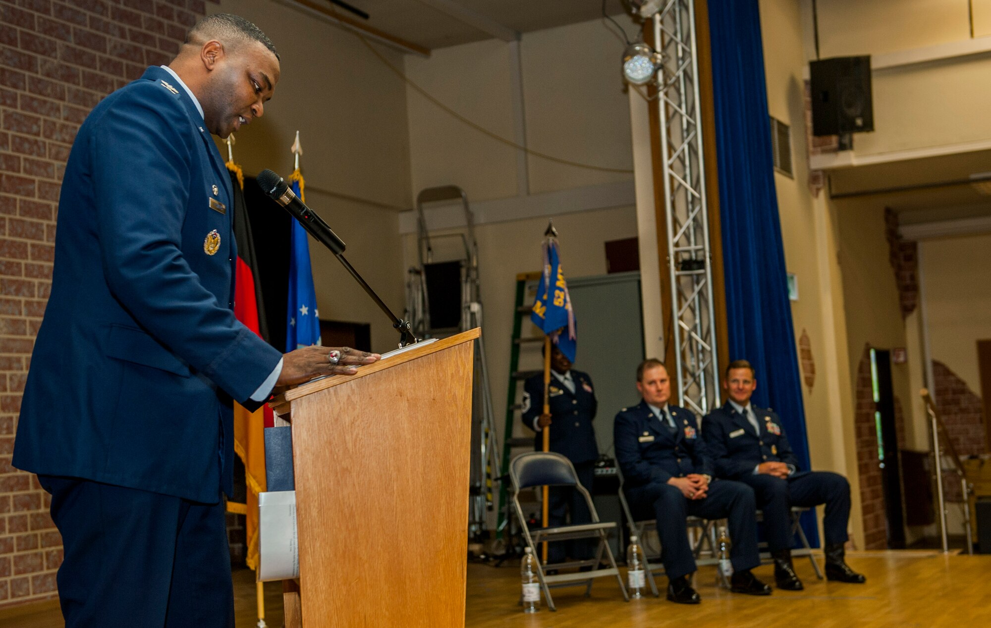 U.S. Air Force Col. Alfred Flowers, 52nd Medical Group commander, left, speaks during the 52nd Medical Support Squadron change of command ceremony in the Brickhouse on Spangdahlem Air Base, Germany, June 30, 2016. Flowers gave a speech bidding the outgoing commander of the 52nd MDSS, U.S. Air Force Lt. Col. Wade Adair, farewell and hailing in the incoming commander, U.S. Air Force Lt. Col. Thomas Lesnick. (U.S. Air Force photo by Airman 1st Class Timothy Kim/Released)