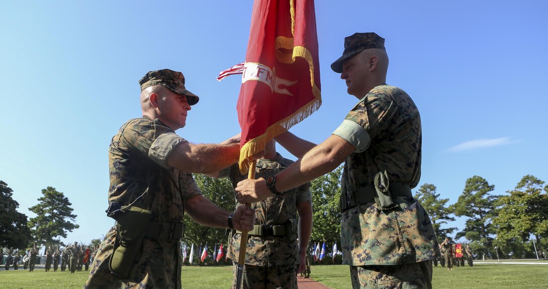 Col. Robert C. Fulford relinquishes command of the 26th Marine Expeditionary Unit to Col. Farrell J. Sullivan during a change of command ceremony at Marine Corps Base Camp Lejeune, July 7. (U.S. Marine Corps photo by Staff Sgt. Bobby J. Yarbrough/Released)