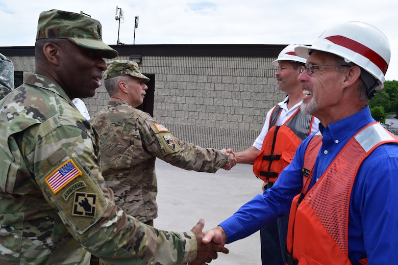 Command Sgt. Maj. Antonio Jones, U.S. Army Corps of Engineers and Lt. Gen. Todd Semonite, USACE commanding general, greets Donald Fogel, Pittsburgh District Maintenance Branch chief, and Dane Summerville, district dive coordinator, at Montgomery Locks and Dam on the Ohio River, June 22.