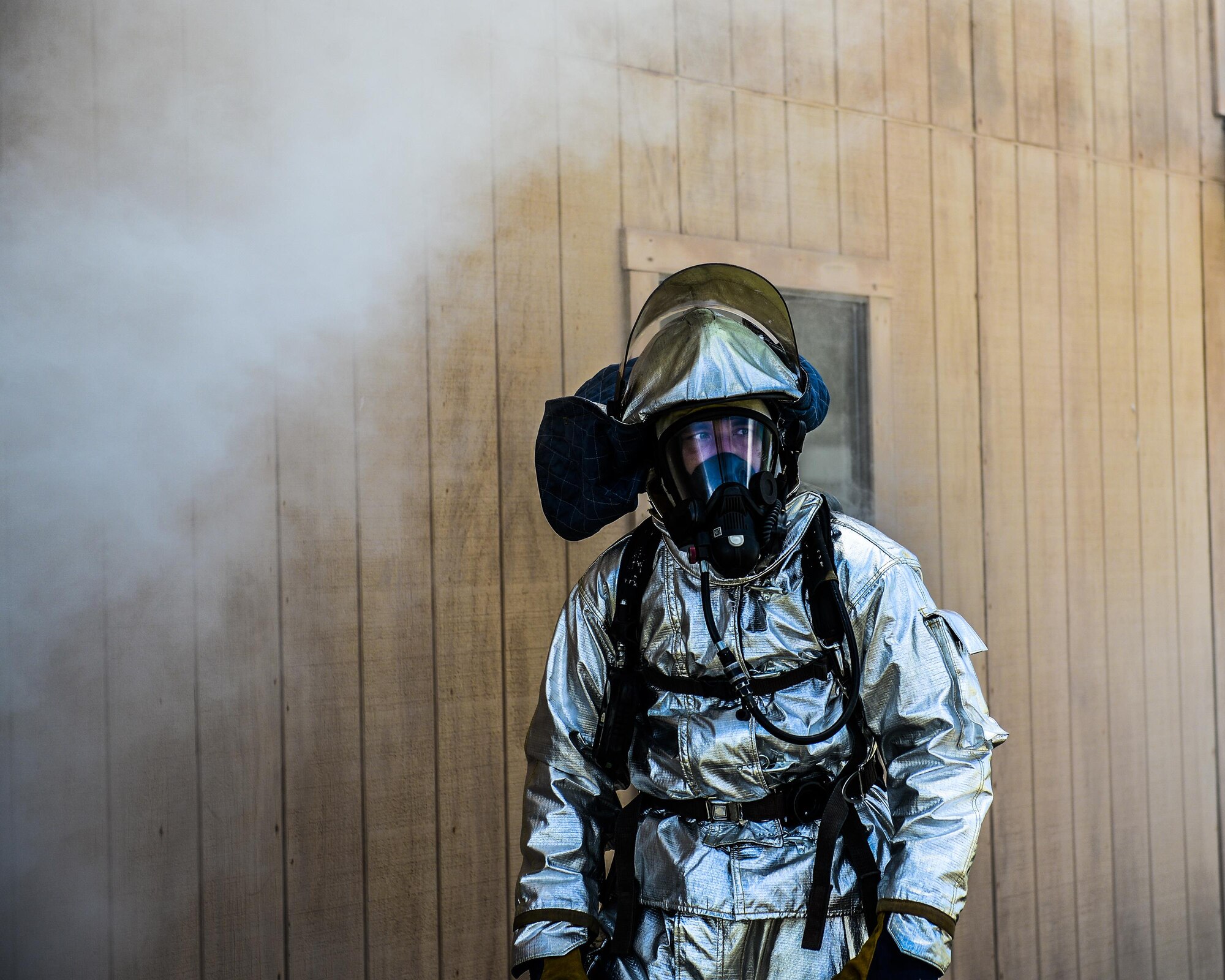 A U.S. Air Force firefighter waits to begin a burning building rescue exercise at Tyndall Air Force Base’s Silver Flag exercise site, June 24, 2016. Firefighters receive special hands-on training at the Silver Flag site. The 823rd RED HORSE's primary wartime responsibility is to provide a highly rapid-deployable, self-sufficient civil engineer response force to support contingency and special operations worldwide. (U.S. Air Force photo by Airman 1st Class Cody R. Miller/Released)