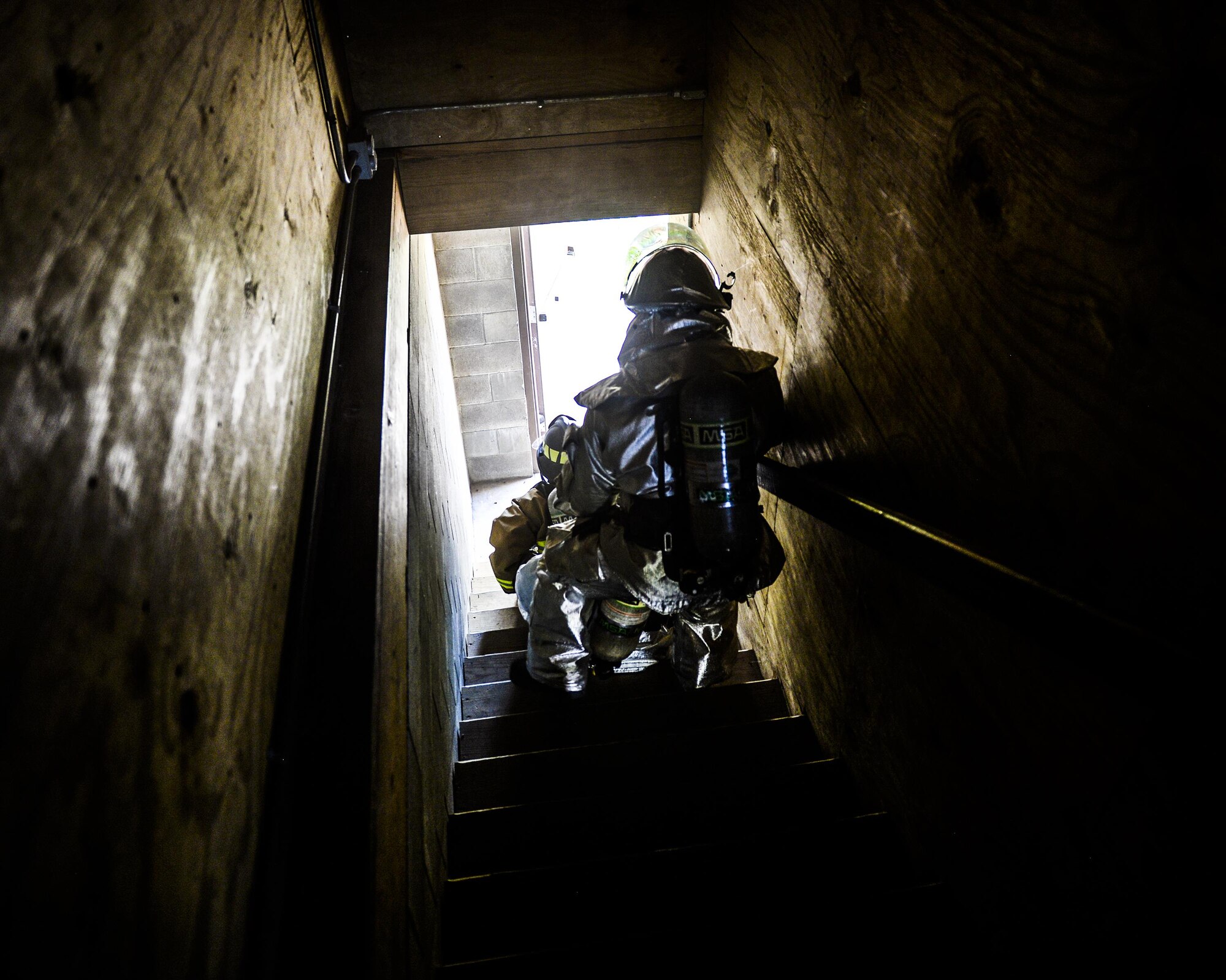 U.S. Air Force firefighters practice rapid victim rescue procedures in a burning building exercise at Tyndall Air Force Base’s Silver Flag exercise site, June 24, 2016. The cadre at the Det. 1, 823rd REDHORSE teach a seven-day course that instructs civil engineers, communications, force support and finance personnel on how to build and maintain bare-base operations at forward-deployed locations. Students hone a variety of combat and survival skills, such as repairing damaged runways and setting up base facilities; fire fighters receive specific expeditionary training that supply the combatant commander with a highly trained and skilled emergency response force. (U.S. Air Force photo by Airman 1st Class Cody R. Miller/Released)