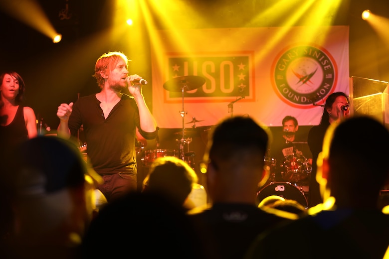 Dan Myers, a member of the Lt. Dan Band, sings during a performance on the Two Rivers Theater stage at Marine Corps Air Station Cherry Point, N.C., July 5, 2016. Gary Sinise and the Lt. Dan Band have participated in 70 United Service Organization tours since they came together. In total, they have entertained more than 363,000 service members and military families in 13 countries. The band puts on shows to raise spirits, funds and awareness for severely wounded warriors in need. Myers is a vocalist and violinist with Gary Sinise and the Lt. Dan Band. (U.S. Marine Corps photo by Lance Cpl. Mackenzie Gibson/Released)