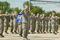 Chief Master Sgt. David Belcher, 5th Mission Support Group superintendent, gives the “present arms” command during a formal Retreat Ceremony at Minot Air Force Base, N.D., June 29, 2016. The ceremony was held in honor of Flag Day. (U.S. Air Force photo/Senior Airman Apryl Hall)