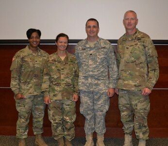 Col. Toni A. Glover, 650th Regional Support Group commanding officer, Col. Chandra M. Roberts, 469th Combat Sustainment Support Command outgoing commander, Lt. Col. Michael A. Roark, incoming 469th CSSB commander, and Brig. Gen. David Elwell, 311th Expeditionary Sustainment Command commanding general, were present June 26, during a change of command ceremony at the Moffett Naval Air Station in Mountain View, Calif., where the 63rd Regional Support Command is located.