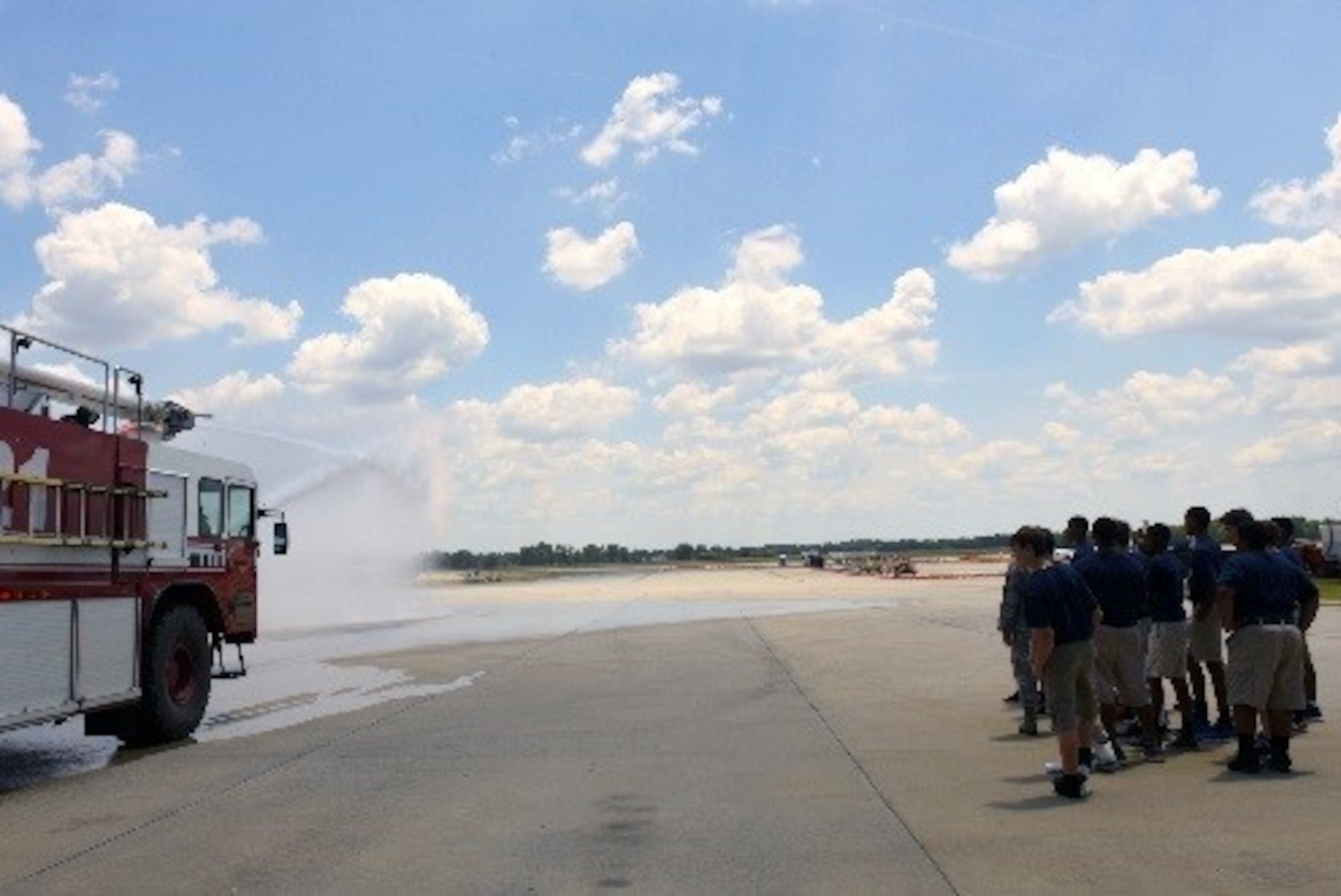 Camp Confidence students observe a firetruck demonstration during a base tour, June 27, 2016, at Seymour Johnson Air Force Base, North Carolina. During their tour, the students visited the 334th Fighter Squadron, the load barn and the fire station. (U.S. Air Force photo/Airman 1st Class Ashley Williamson)