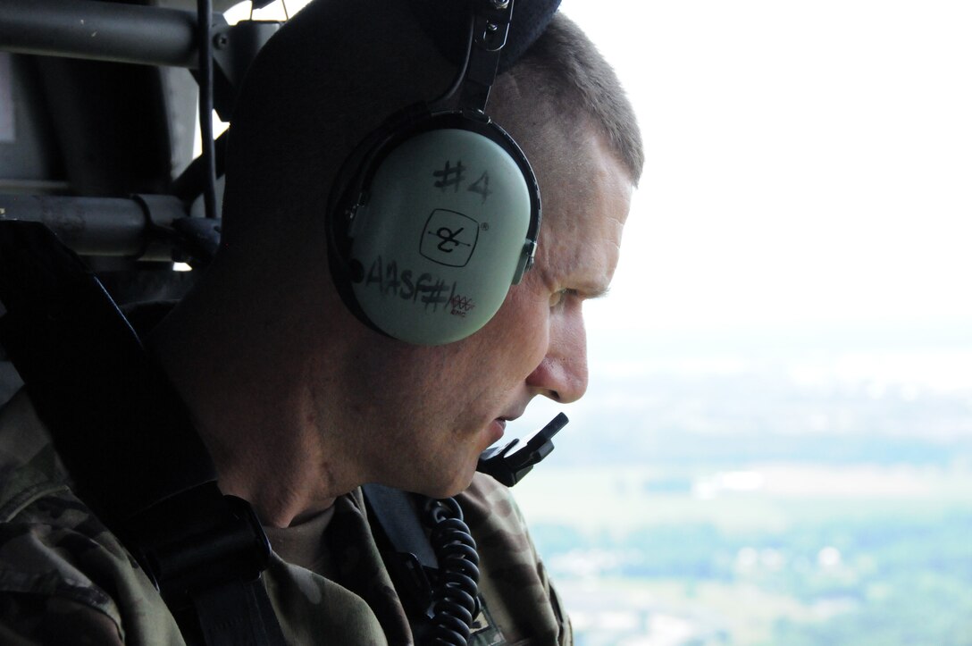 Sgt. Maj. of the Army Daniel Dailey receives an aerial tour July 7 of the facilities at Joint Base McGuire-Dix-Lakehurst, New Jersey.  The flight covered all areas of the joint base and was designed to give SMA  Dailey an introduction into the readiness capabilities of not only Soldiers but the other servicemembers stationed at the post.  The aerial tour was part of a two-day visit which also included conducting physical fitness training with Soldiers and hosting a town hall meeting.