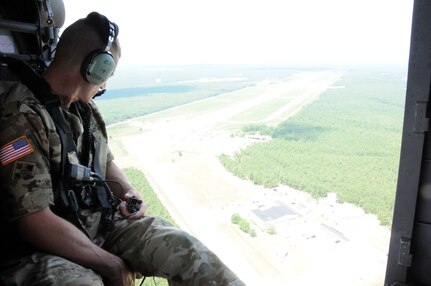 Sgt. Maj. of the Army Daniel Dailey receives an aerial tour July 7 of the facilities at Joint Base McGuire-Dix-Lakehurst, New Jersey.  The flight covered all areas of the joint base and was designed to give SMA  Dailey an introduction into the readiness capabilities of not only Soldiers but the other servicemembers stationed at the post.  The aerial tour was part of a two-day visit which also included conducting physical fitness training with Soldiers and hosting a town hall meeting.