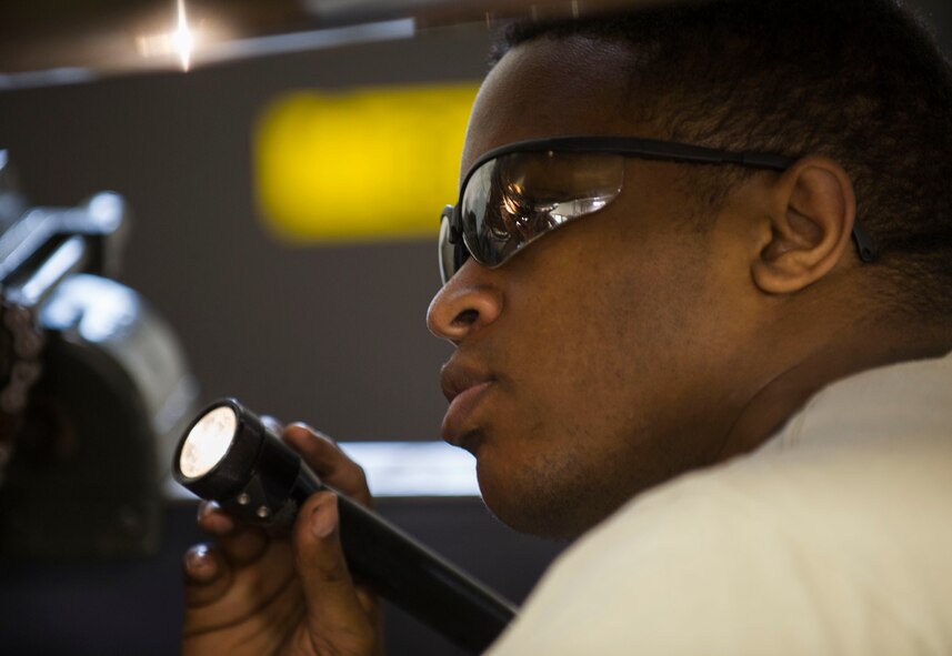 Staff Sgt. Korie Parker, 5th Maintenance Group engine trending and diagnostic monitor, inspects a B-52 combine engine at Minot Air Force Base, N.D., July 5, 2016. Parker and the engine management shop govern the utilization, distribution and significant historical data on nearly 600 combine engines. (U.S. Air Force photo/Senior Airman Apryl Hall)