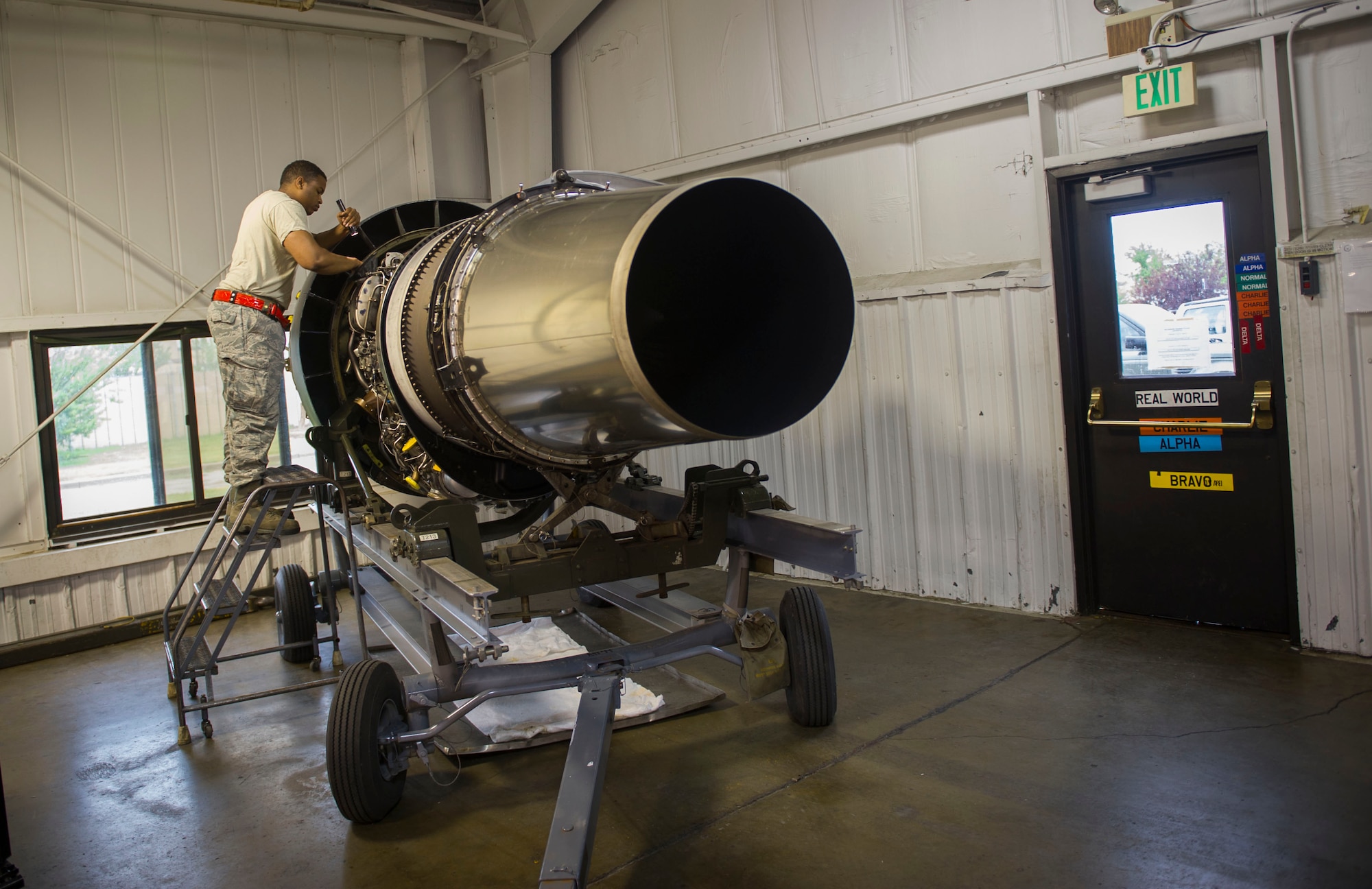 Staff Sgt. Korie Parker, 5th Maintenance Group engine trending and diagnostic monitor, inspects a B-52 combine engine at Minot Air Force Base, N.D., July 5, 2016. The engine management shop is the focal point for maintaining and distributing the combine engines. (U.S. Air Force photo/Senior Airman Apryl Hall)