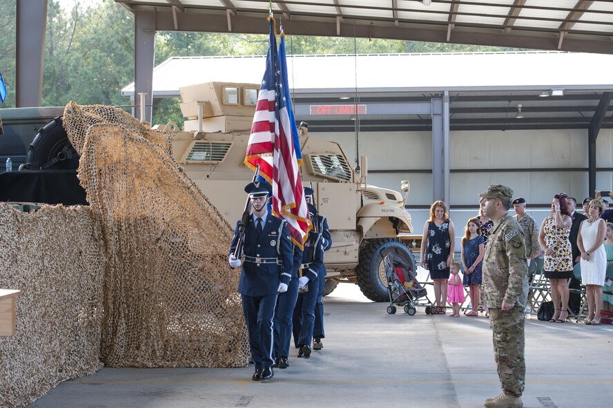 Moody’s Base Honor Guard presents the colors during a change of command ceremony, July 7, 2016, at Moody Air Force Base, Ga. During the ceremony, U.S. Air Force Col. Michael Ross, relinquished command of the 820th Base Defense Group as Col. Kevin Walker assumed command. (U.S. Air Force photo by Airman 1st Class Lauren M. Hunter/Released)