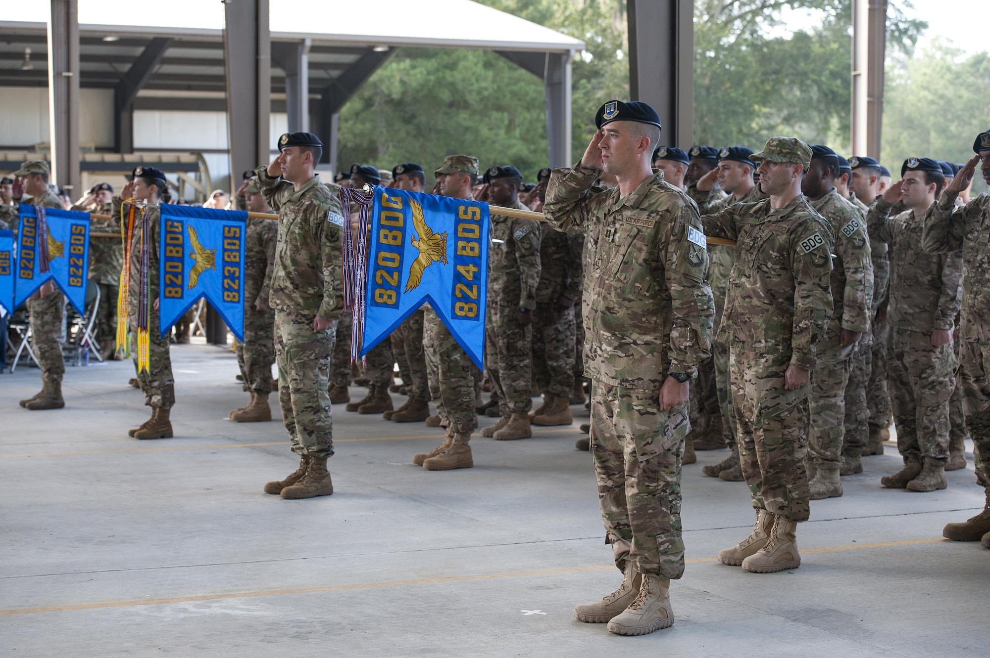 U.S. Air Force Airmen from the 820th Base Defense Group render a salute during a change of command ceremony, July 7, 2016, at Moody Air Force Base, Ga. The 820th BDG is the first and only Air Force unit designed specifically to provide fully integrated defense operations worldwide. (U.S. Air Force photo by Airman 1st Class Lauren M. Hunter/Released)