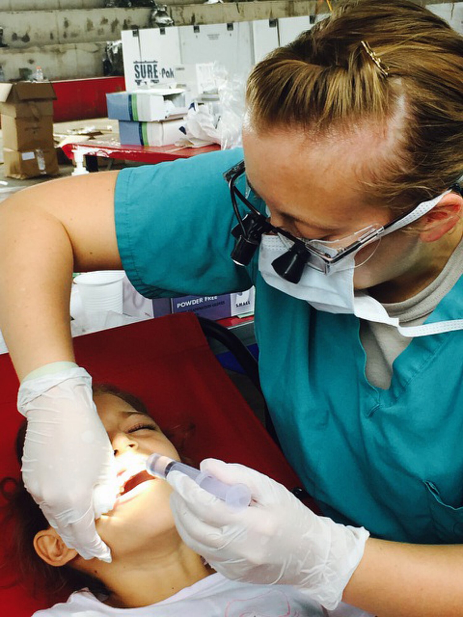 Capt. Jenna Chase, 22nd Aerospace Medicine Squadron dentist, extracts a tooth, May 28, 2016, in La Blanca, Guatemala, during a medical readiness training exercise. Military members treated approximately 8,500 patients during the exercise to help prepare them for situations they could encounter during real-world deployments. (Courtesy photo)