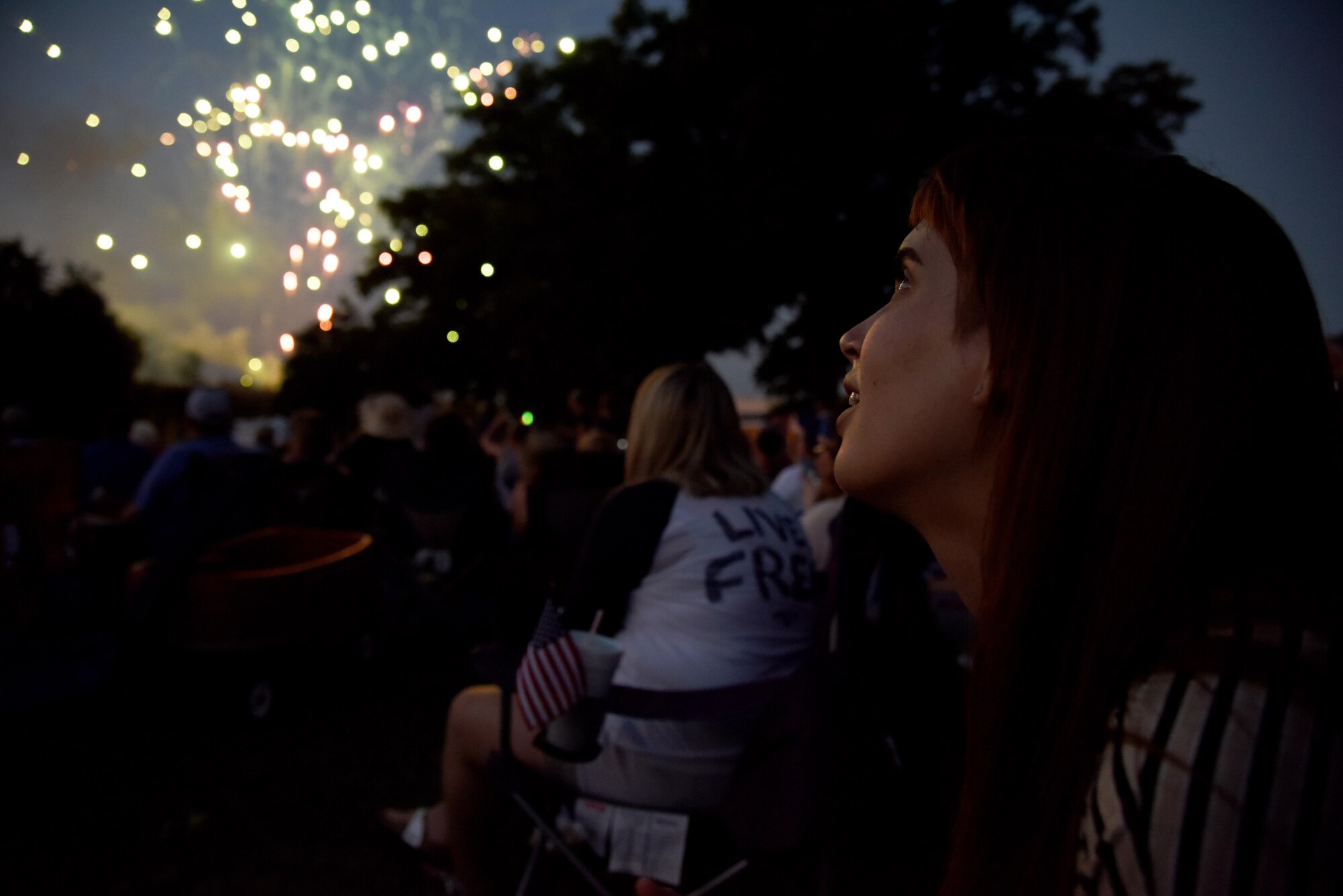 Natalie Ray, 29th Annual San Angelo Symphony’s July 3rd Pops Concert attendee, views fireworks at the Pops Concert at the Bill Aylor Sr. Memorial RiverStage in San Angelo, Texas, July 3, 2016. This is Ray’s first time viewing the Pops Concert and she said enjoyed the concert and was surprised how supportive the community is to its service members. (U.S. Air Force photo by Senior Airman Joshua Edwards/Released)